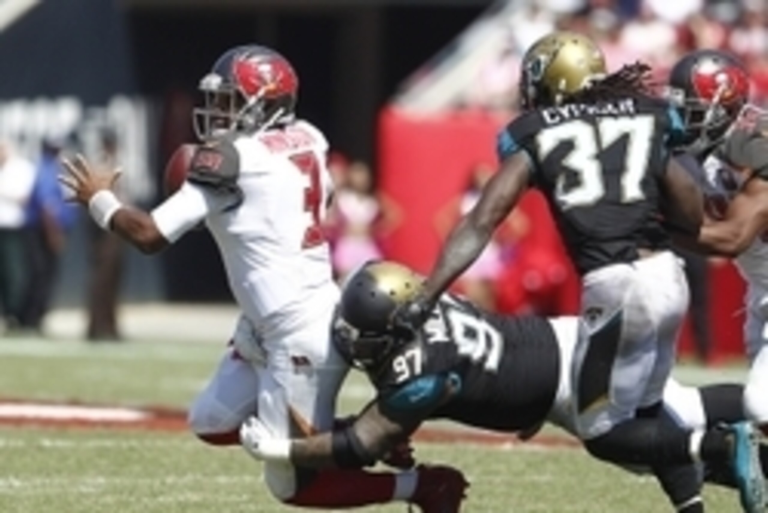 Oct 11, 2015; Tampa, FL, USA; Jacksonville Jaguars defensive tackle Roy Miller (97) sacks Tampa Bay Buccaneers quarterback Jameis Winston (3) during the second quarter of an NFL football game at Raymond James Stadium. Mandatory Credit: Reinhold Matay-USA 