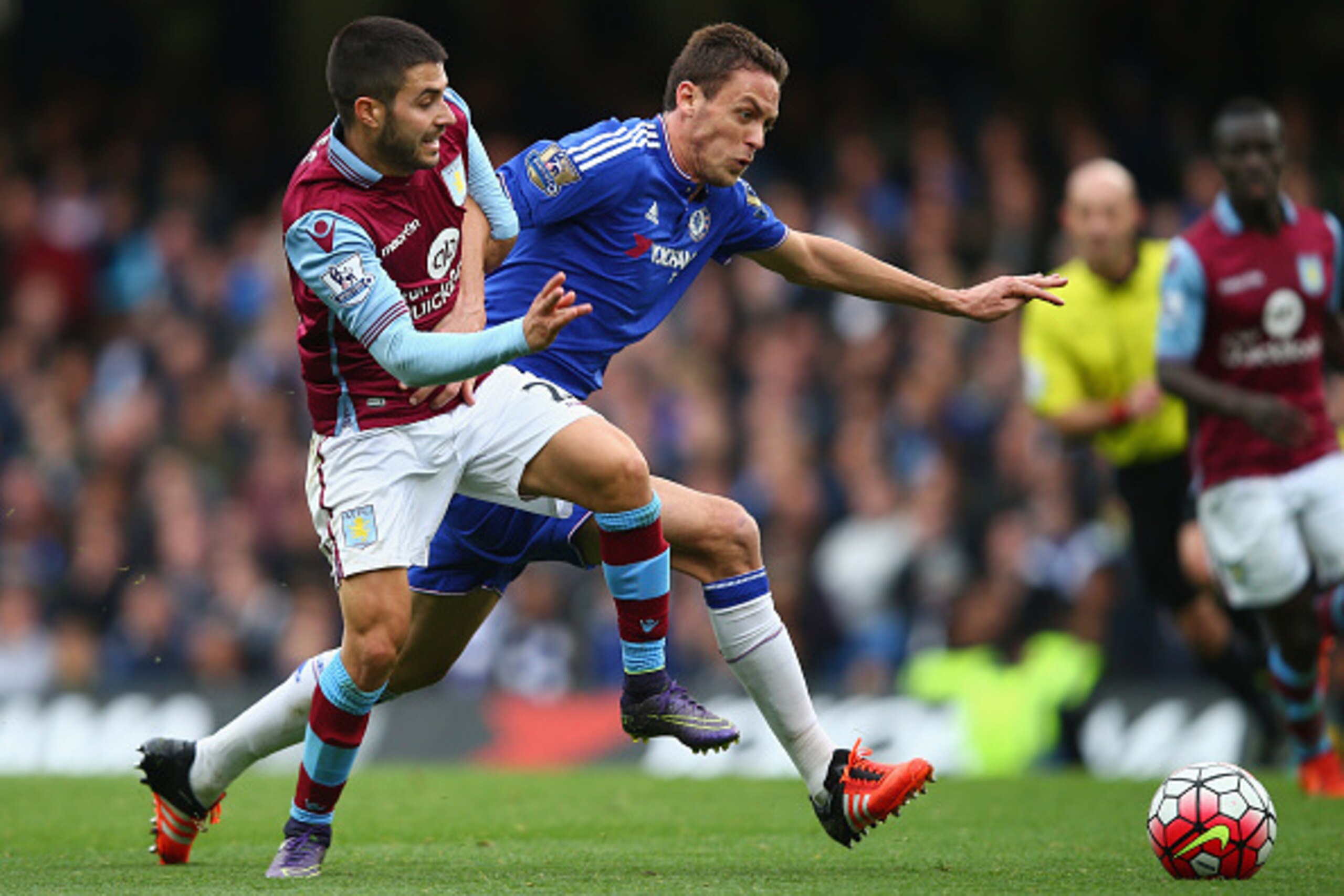 LONDON, ENGLAND - OCTOBER 17: Nemanja Matic of Chelsea and Carles Gil of Aston Villa compete for the ball during the Barclays Premier League match between Chelsea and Aston Villa at Stamford Bridge on October 17, 2015 in London, England.  (Photo by Clive 