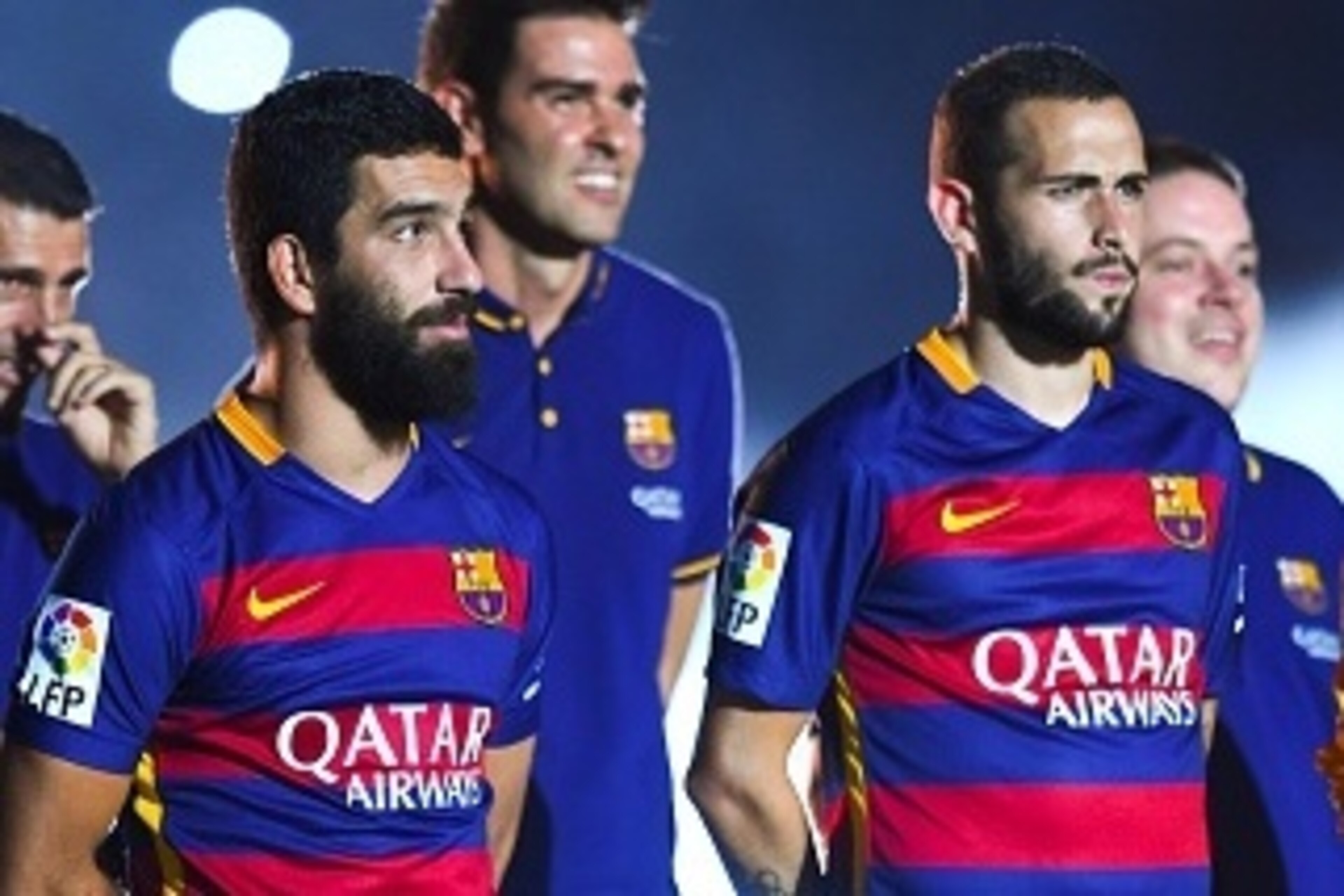BARCELONA, SPAIN - AUGUST 05:  Arda Turan (L) and Aleix Vidal of FC Barcelona look on during the team official presentation ahead of the Joan Gamper trophy match at Camp Nou on August 5, 2015 in Barcelona, Spain.  (Photo by David Ramos/Getty Images)