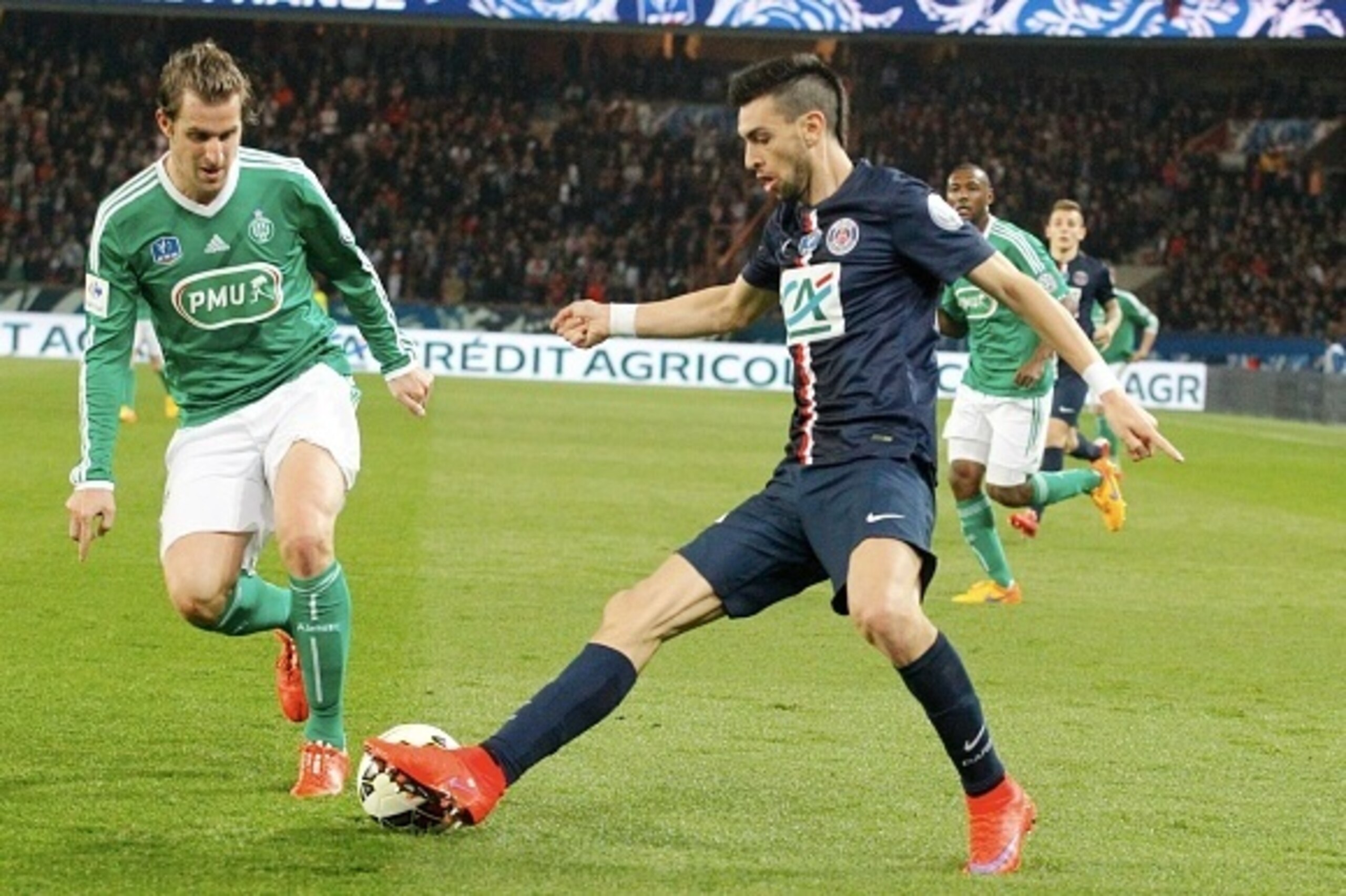 PARIS, FRANCE - APRIL 08:  Javier Pastore (R) of Paris Saint-Germain and Francois Clerc of ASSE Saint-Etienne in action during the French  Cup Semi-Final between Paris Saint-Germain and ASSE Saint-Etienne at Parc Des Princes on april 8, 2015 in Paris, Fra