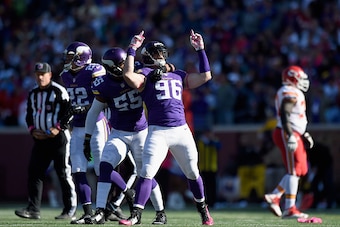 MINNEAPOLIS, MN - OCTOBER 18: (L-R) Harrison Smith #22, Anthony Barr #55 and Brian Robison #96 of the Minnesota Vikings celebrate a fumble recovery by Robison during the fourth quarter of the game on October 18, 2015 at TCF Bank Stadium in Minneapolis, Mi
