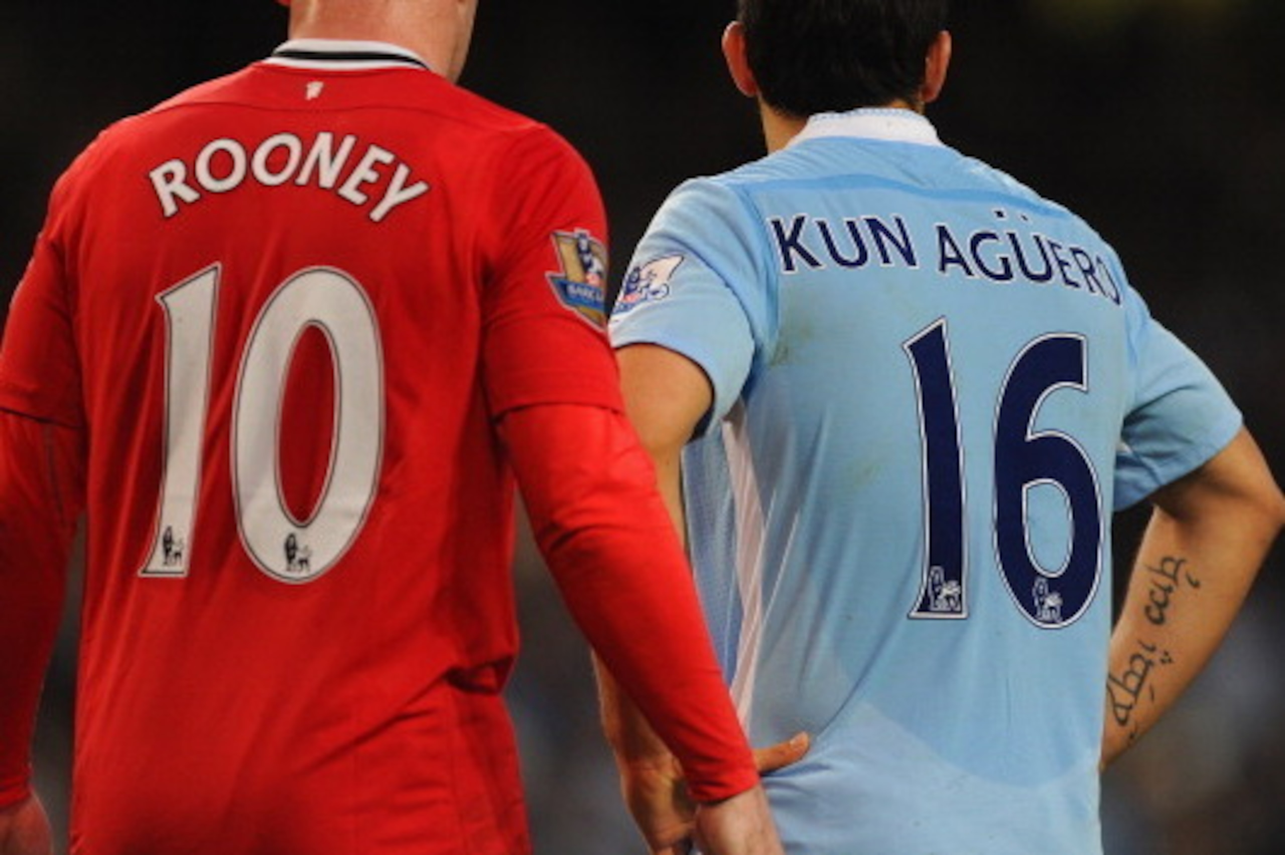 MANCHESTER, ENGLAND - APRIL 30:  Wayne Rooney of Manchester United and Sergio Aguero of Manchester City during the Barclays Premier League match between Manchester City and Manchester United at Etihad Stadium on April 30, 2012 in Manchester, England.  (Ph