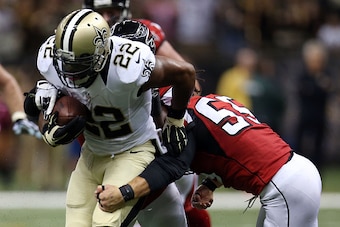 NEW ORLEANS, LA - OCTOBER 15:  Mark Ingram #22 of the New Orleans Saints is hit by Paul Worrilow #55 of the Atlanta Falcons during the fourth quarter of a game at the Mercedes-Benz Superdome on October 15, 2015 in New Orleans, Louisiana.  (Photo by Chris 