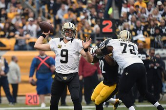 PITTSBURGH, PA - NOVEMBER 30:  Quarterback Drew Brees #9 of the New Orleans Saints passes as offensive lineman Terron Armstead #72 blocks linebacker James Harrison #92 of the Pittsburgh Steelers during a game at Heinz Field on November 30, 2014 in Pittsbu