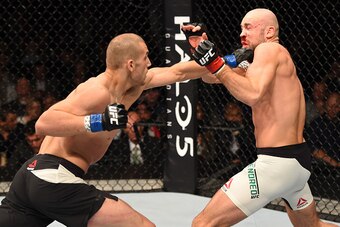 DUBLIN, IRELAND - OCTOBER 24:  (L-R) Tom Breese punches Cathal Pendred in their welterweight fight during the UFC event at 3Arena on October 24, 2015 in Dublin, Ireland. (Photo by Josh Hedges/Zuffa LLC/Zuffa LLC via Getty Images)