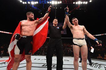DUBLIN, IRELAND - OCTOBER 24:  (R-L) Darren Till and Nicolas Dalby raise their hands as the judges give them a draw in their welterweight fight during the UFC event at 3Arena on October 24, 2015 in Dublin, Ireland. (Photo by Josh Hedges/Zuffa LLC/Zuffa LL