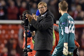 Liverpool's German manager  Jurgen Klopp (C) applauds after a   UEFA Europa League group B football match between Liverpool FC and FC Rubin Kazan at Anfield in Liverpool, north west England, on October 22, 2015.  AFP PHOTO / OLI SCARFF        (Photo credi