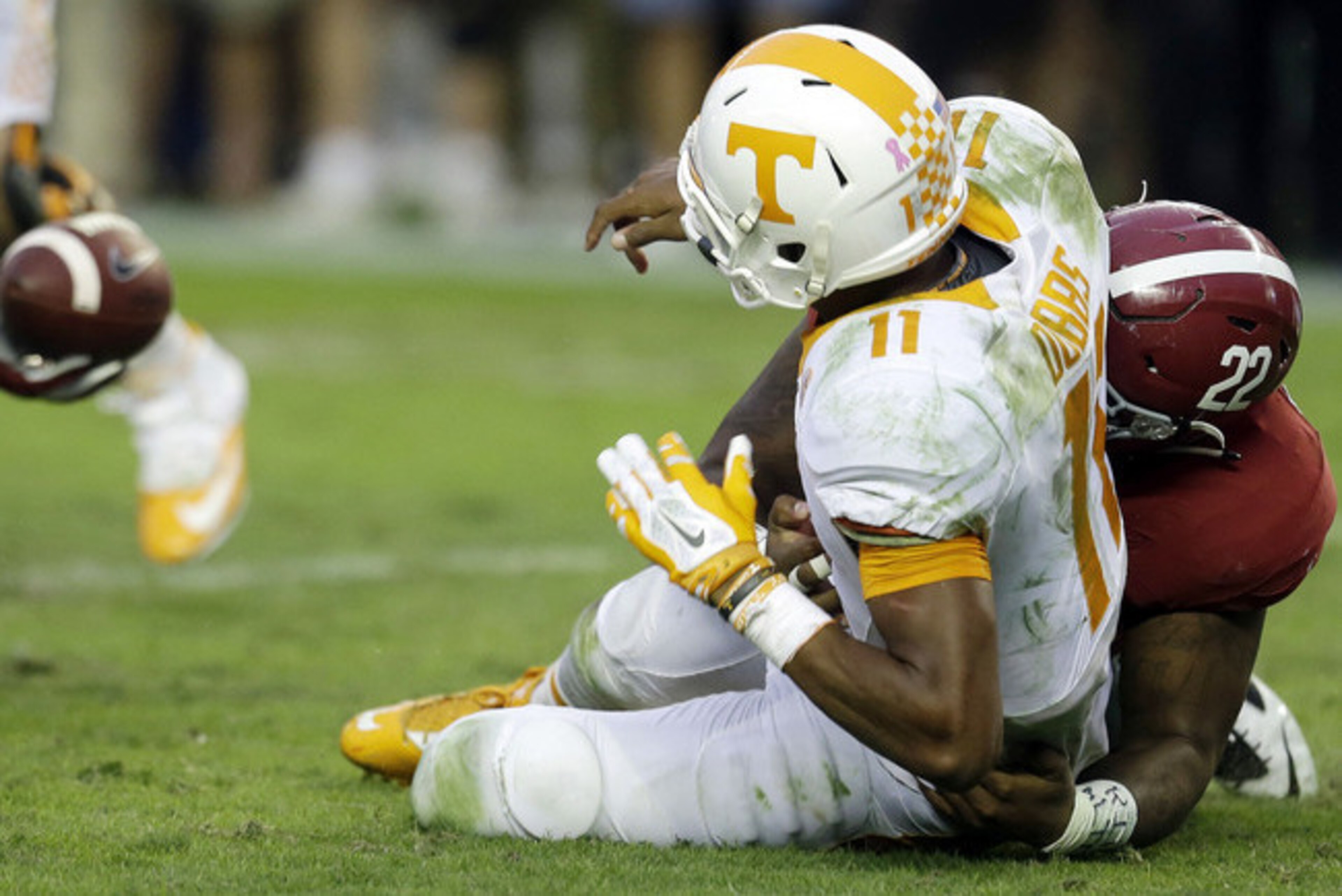 Tennessee QB Joshua Dobbs (11) and Alabama LB Ryan Anderson (22)