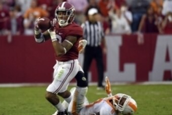 Oct 24, 2015; Tuscaloosa, AL, USA; Alabama Crimson Tide wide receiver ArDarius Stewart (13) pulls down a pass over Tennessee Volunteers defensive back Justin Martin (8) during the fourth quarter at Bryant-Denny Stadium. Mandatory Credit: John David Mercer