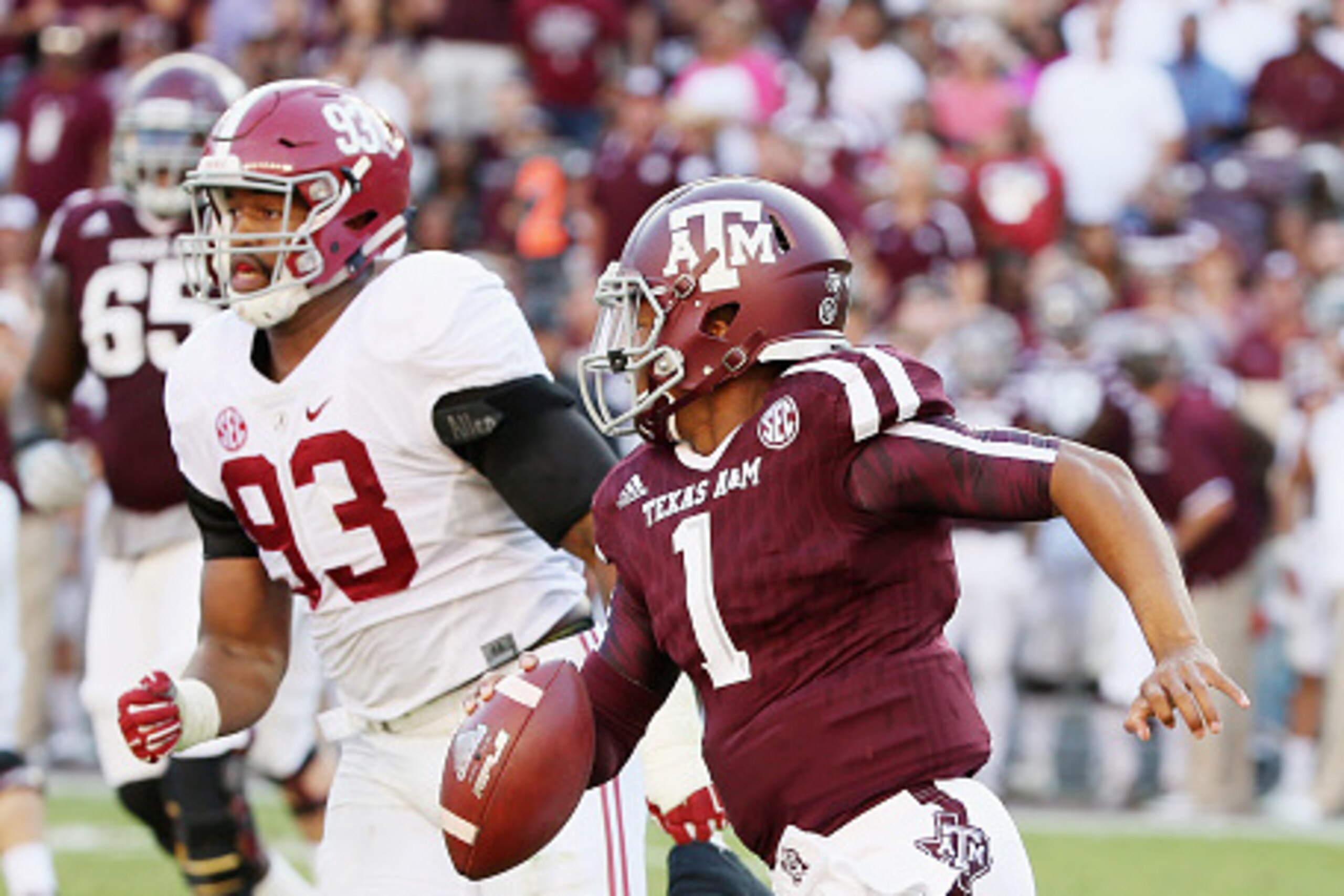 COLLEGE STATION, TX - OCTOBER 17:  Quarterback Kyler Murray #1 of the Texas A&M Aggies runs with the football in front of Jonathan Allen #93 of the  Alabama Crimson Tide  in the second half of their game at Kyle Field on October 17, 2015 in College Statio