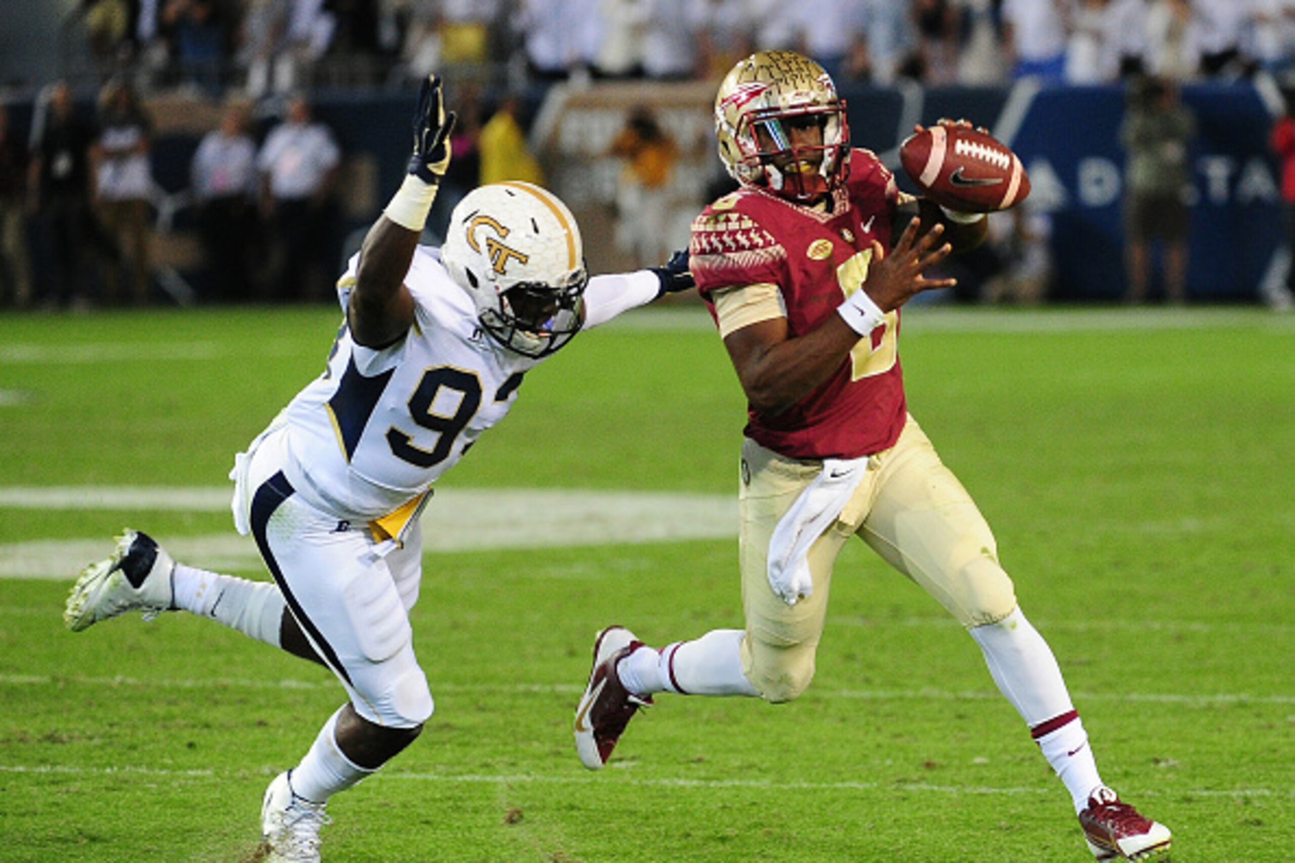 ATLANTA, GA - OCTOBER 24: Everett Golson #6 of the Florida State Seminoles looks to pass left-handed as he is pursued by Antonio Simmons #93 of the Georgia Tech Yellow Jackets on October 24, 2015 at Bobby Dodd Stadium in Atlanta, Georgia. Photo by Scott C
