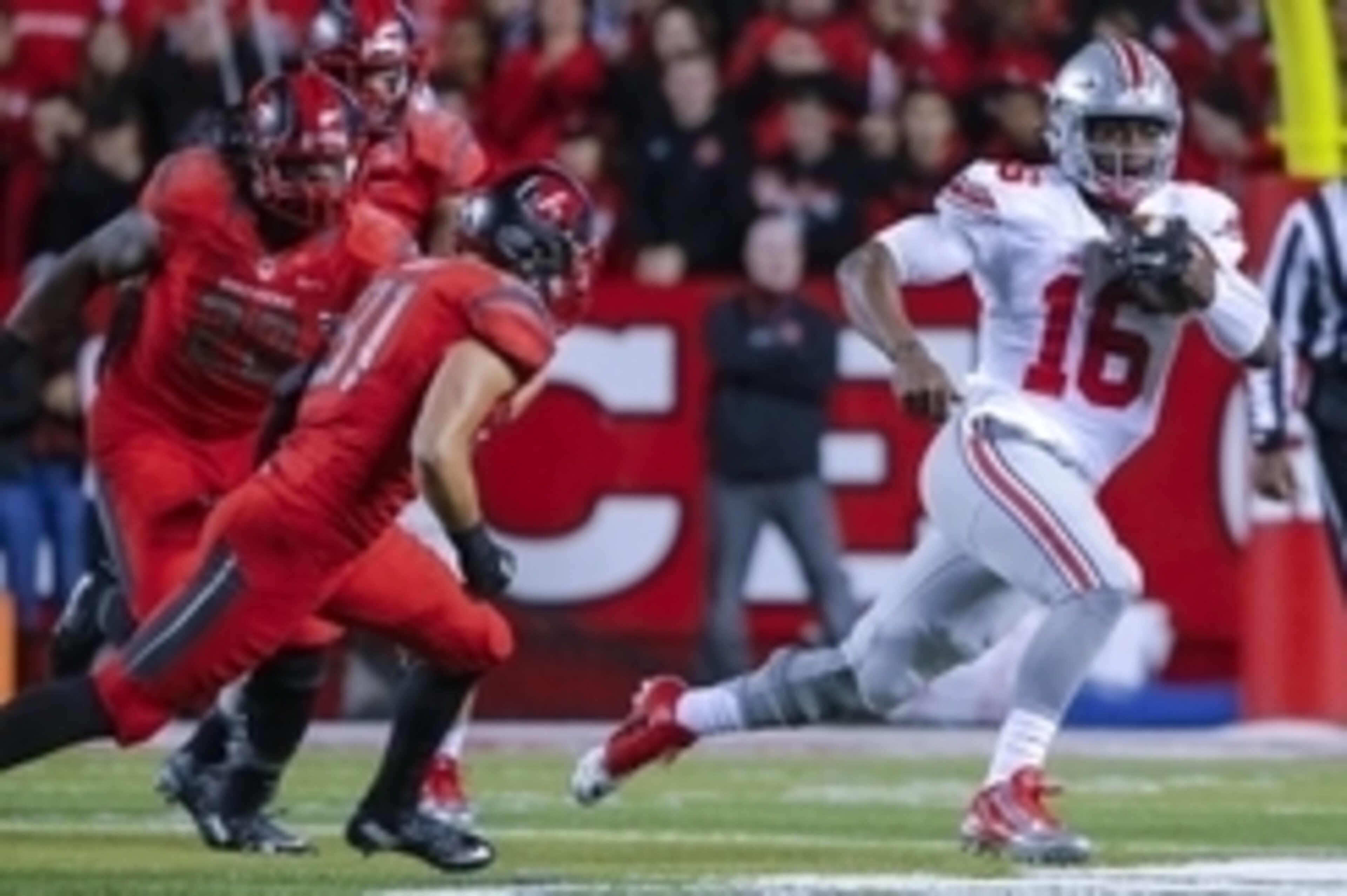 Oct 24, 2015; Piscataway, NJ, USA;  Rutgers Scarlet Knights defensive back Anthony Cioffi (31) pursues Ohio State Buckeyes quarterback J.T. Barrett (16) during the first quarterat High Points Solutions Stadium. Mandatory Credit: Jim O'Connor-USA TODAY Spo