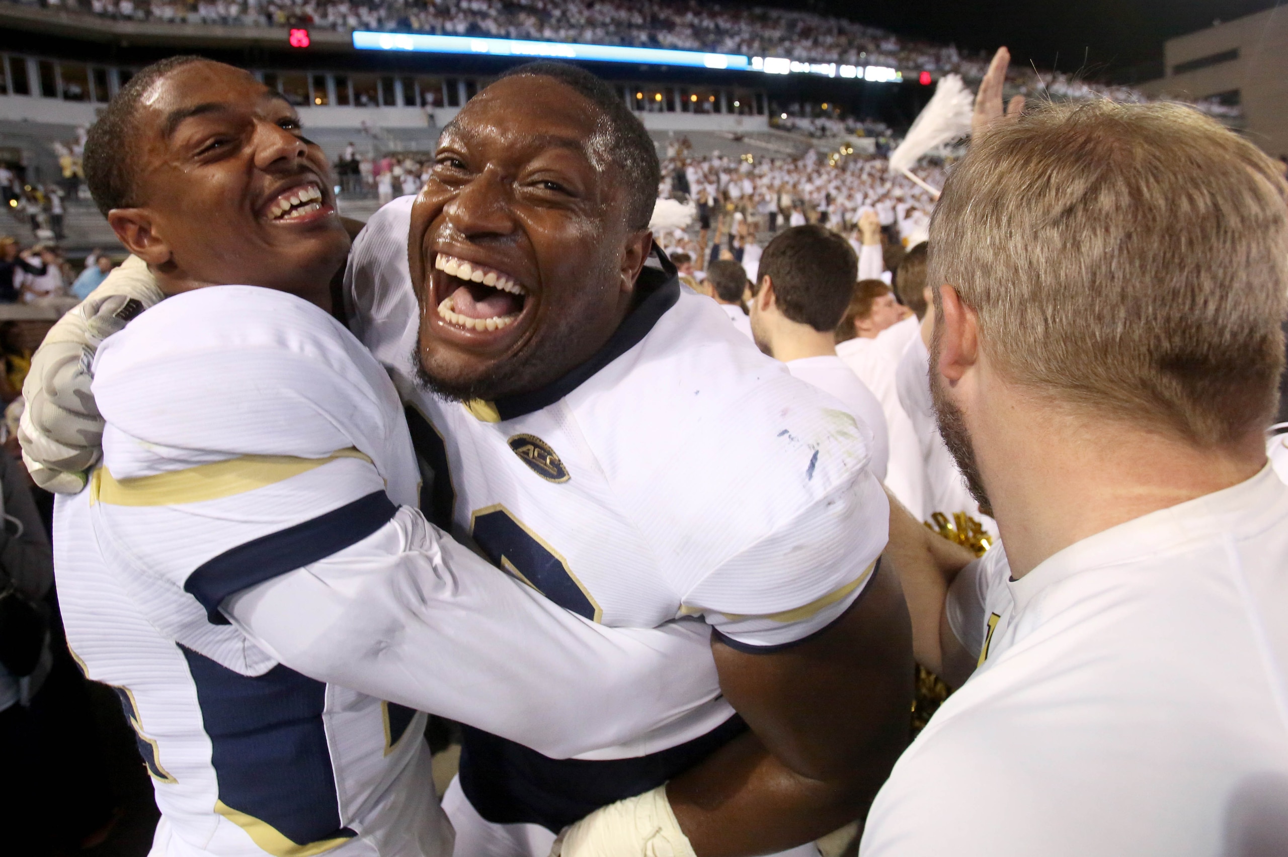 Oct 24, 2015; Atlanta, GA, USA; Georgia Tech Yellow Jackets defensive back Corey Griffin (14) and defensive lineman Jabari Hunt-Days (32) celebrate their win over the Florida State Seminoles at Bobby Dodd Stadium. Georgia Tech won 22-16. Mandatory Credit: