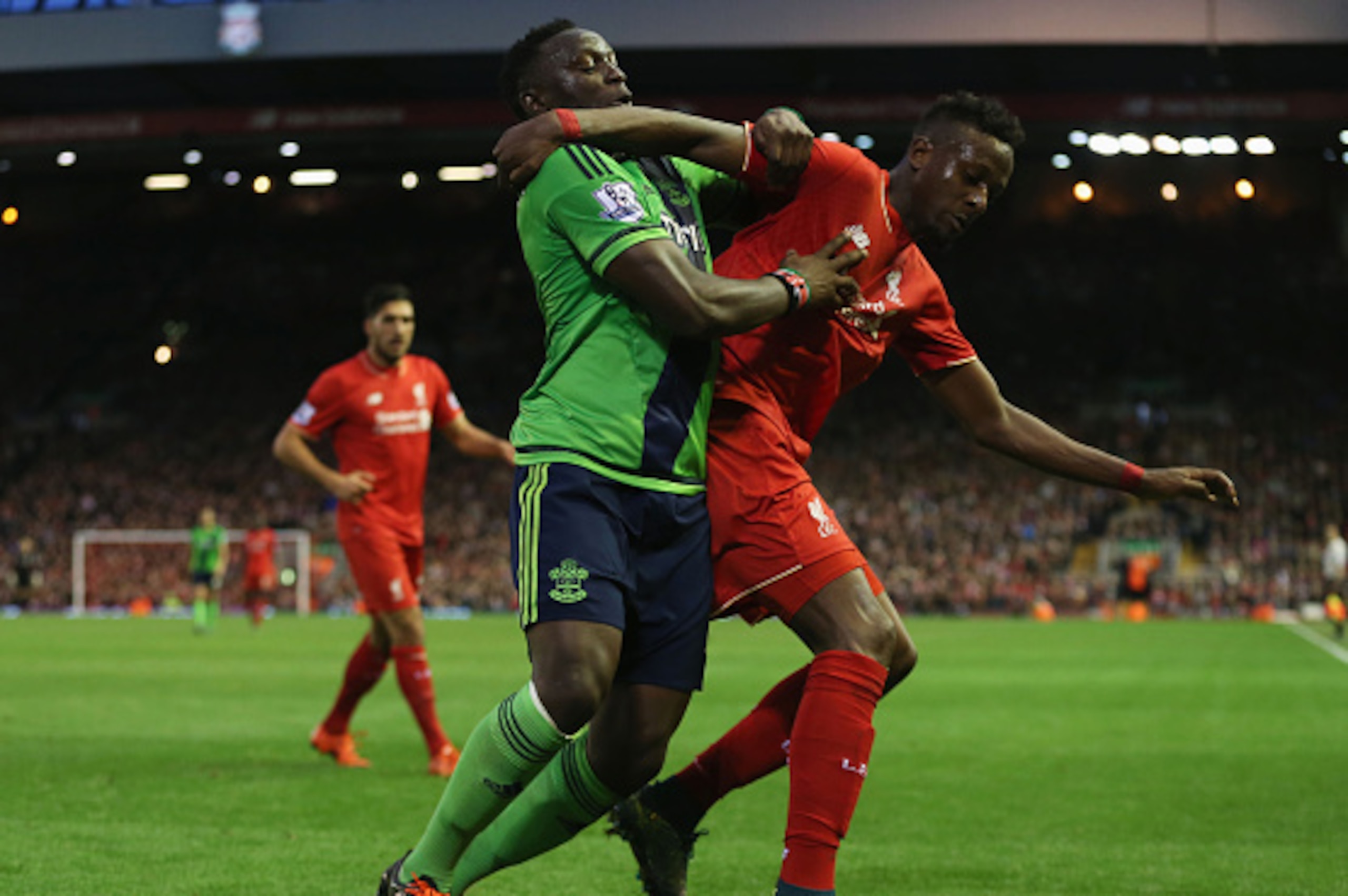 LIVERPOOL, ENGLAND - OCTOBER 25: Divock Origi of Liverpool and Victor Wanyama of Southampton compete for the ball during the Barclays Premier League match between Liverpool and Southampton at Anfield on October 25, 2015 in Liverpool, England.  (Photo by J