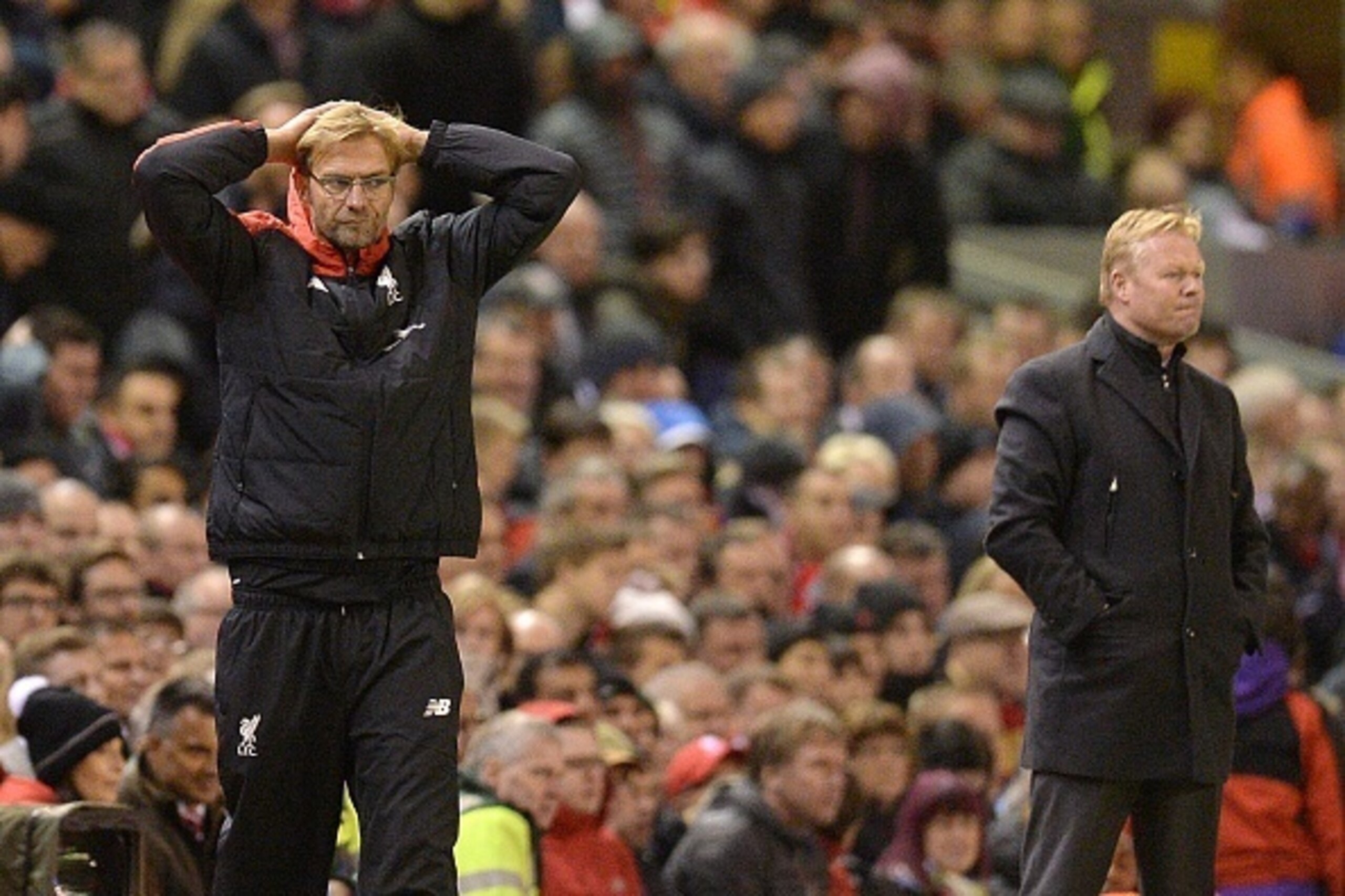 Liverpool's German manager Jurgen Klopp (L) reacts on the touchline as Southampton's Dutch manager Ronald Koeman (R) looks on during the English Premier League football match between Liverpool and Southampton at Anfield stadium in Liverpool, north west En