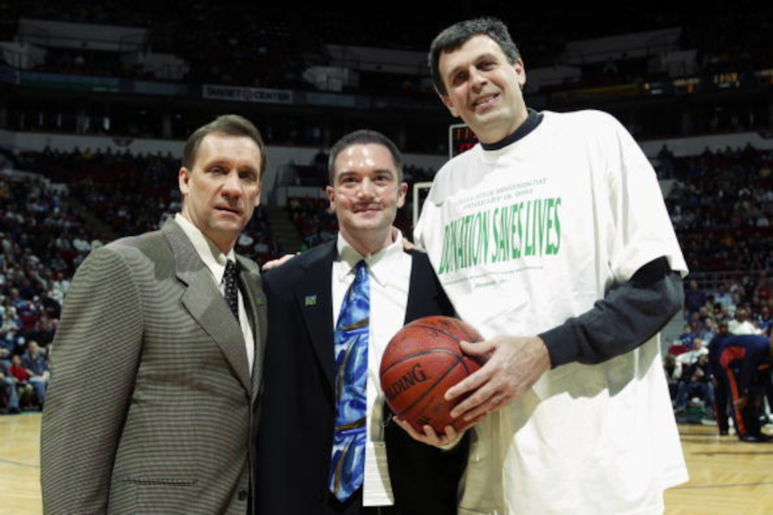 MINNEAPOLIS - FEBRUARY 16: Before the game against the Golden State Warriors, head coach Flip Saunders (left) of the Minnesota Timberwovles and basketball legend Kevin Mchale (right) gives an autographed basketball to a former Timberwolves scout who need MINNEAPOLIS - FEBRUARY 16: Before the game against the Golden State Warriors, head coach Flip Saunders (left) of the Minnesota Timberwovles and basketball legend Kevin Mchale (right) gives an autographed basketball to a former Timberwolves scout who need