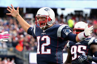 FOXBORO, MA - OCTOBER 25:  Tom Brady #12 of the New England Patriots reacts after throwing a touchdown pass during the fourth quarter against the New York Jets at Gillette Stadium on October 25, 2015 in Foxboro, Massachusetts.  (Photo by Jim Rogash/Getty 