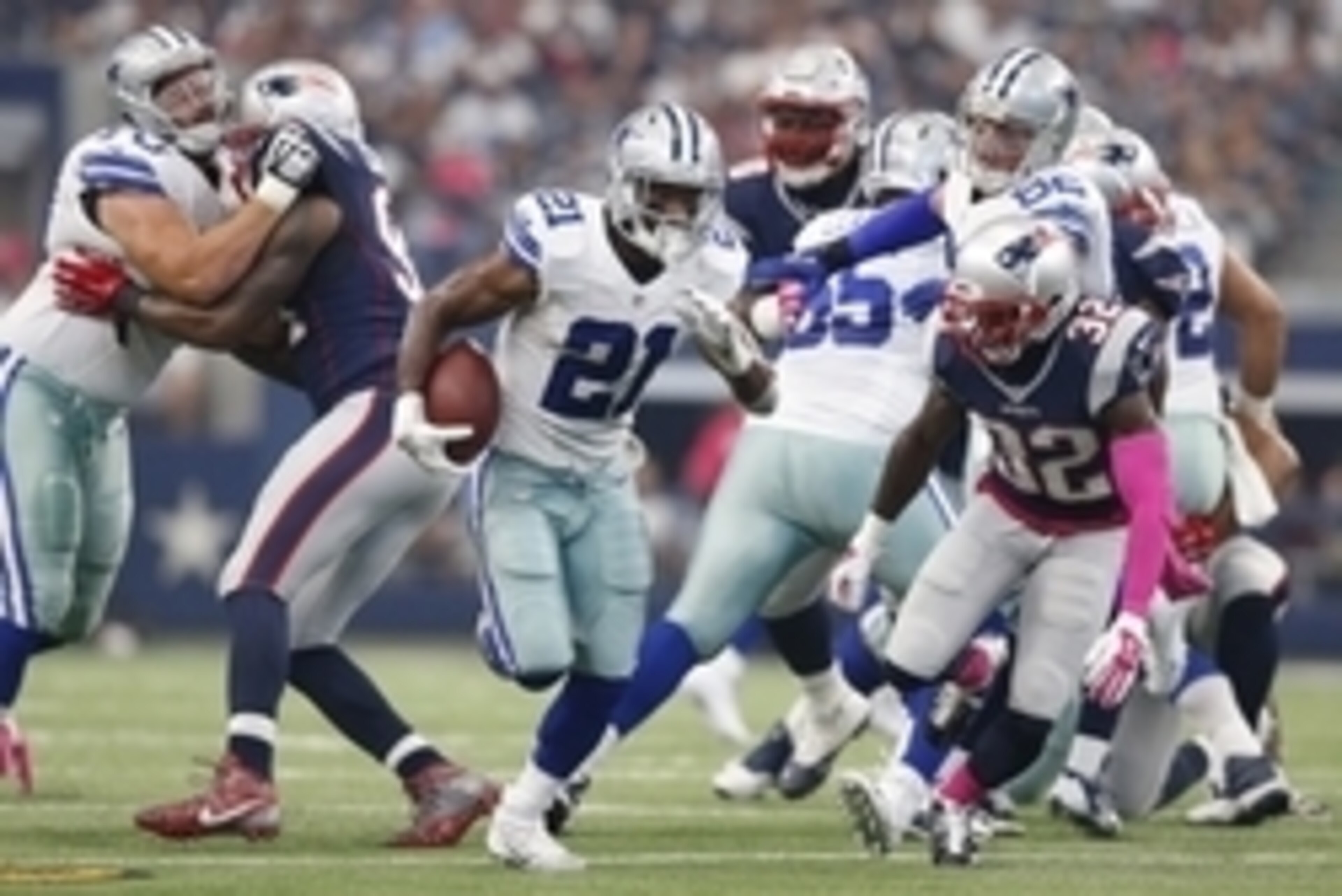 Oct 11, 2015; Arlington, TX, USA; Dallas Cowboys running back Joseph Randle (21) runs with the ball against New England Patriots safety Devin McCourty (32) at AT&T Stadium. Mandatory Credit: Matthew Emmons-USA TODAY Sports