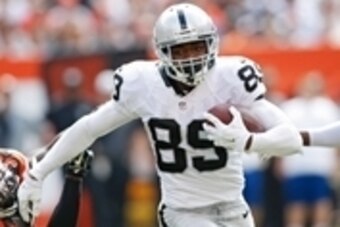 Sep 27, 2015; Cleveland, OH, USA;  Oakland Raiders wide receiver Amari Cooper (89) stiff arms Cleveland Browns free safety Tashaun Gipson (39) during the second quarter at FirstEnergy Stadium. Mandatory Credit: Scott R. Galvin-USA TODAY Sports