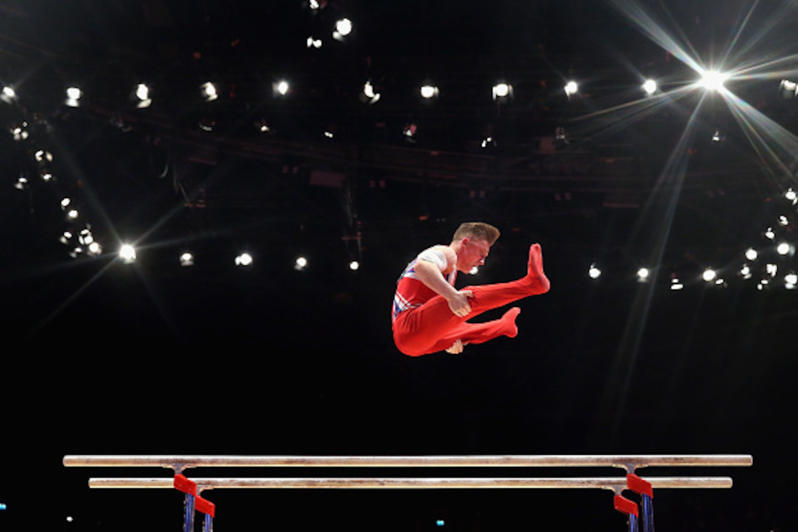 GLASGOW, SCOTLAND - OCTOBER 25: Nile Wilson of Great Britain competes in the Parallel Bars during Day Three of the 2015 World Artistic Gymnastics Championships at The SSE Hydro on October 25, 2015 in Glasgow, Scotland. (Photo by Alex Livesey/Getty Image GLASGOW, SCOTLAND - OCTOBER 25: Nile Wilson of Great Britain competes in the Parallel Bars during Day Three of the 2015 World Artistic Gymnastics Championships at The SSE Hydro on October 25, 2015 in Glasgow, Scotland. (Photo by Alex Livesey/Getty Image