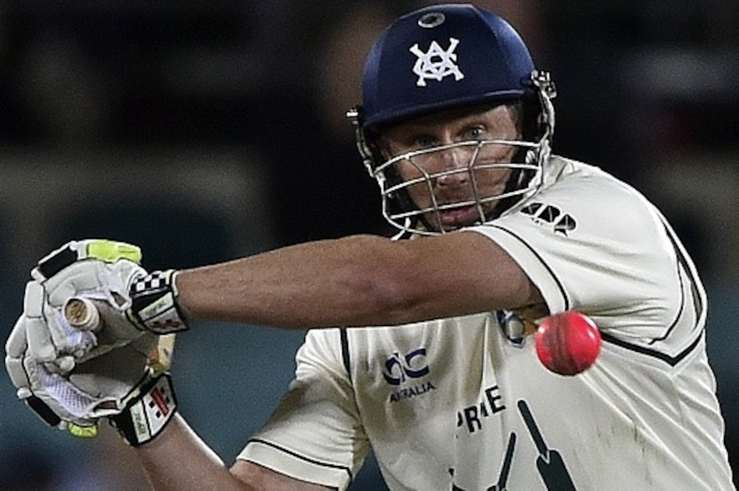 Australia's Prime Minister's XI batsman David Hussey plays a shot off New Zealand's paceman James Neesham during a limited overs cricket match between New Zealand and Australia's Prime Minister's XI in Canberra on October 23, 2015. AFP PHOTO / Saeed KHAN
