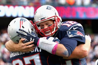 FOXBORO, MA - OCTOBER 25:  Tom Brady #12 and Rob Gronkowski #87 of the New England Patriots react after Gronkowski scored a touchdown during the fourth quarter against the New York Jets at Gillette Stadium on October 25, 2015 in Foxboro, Massachusetts.  (