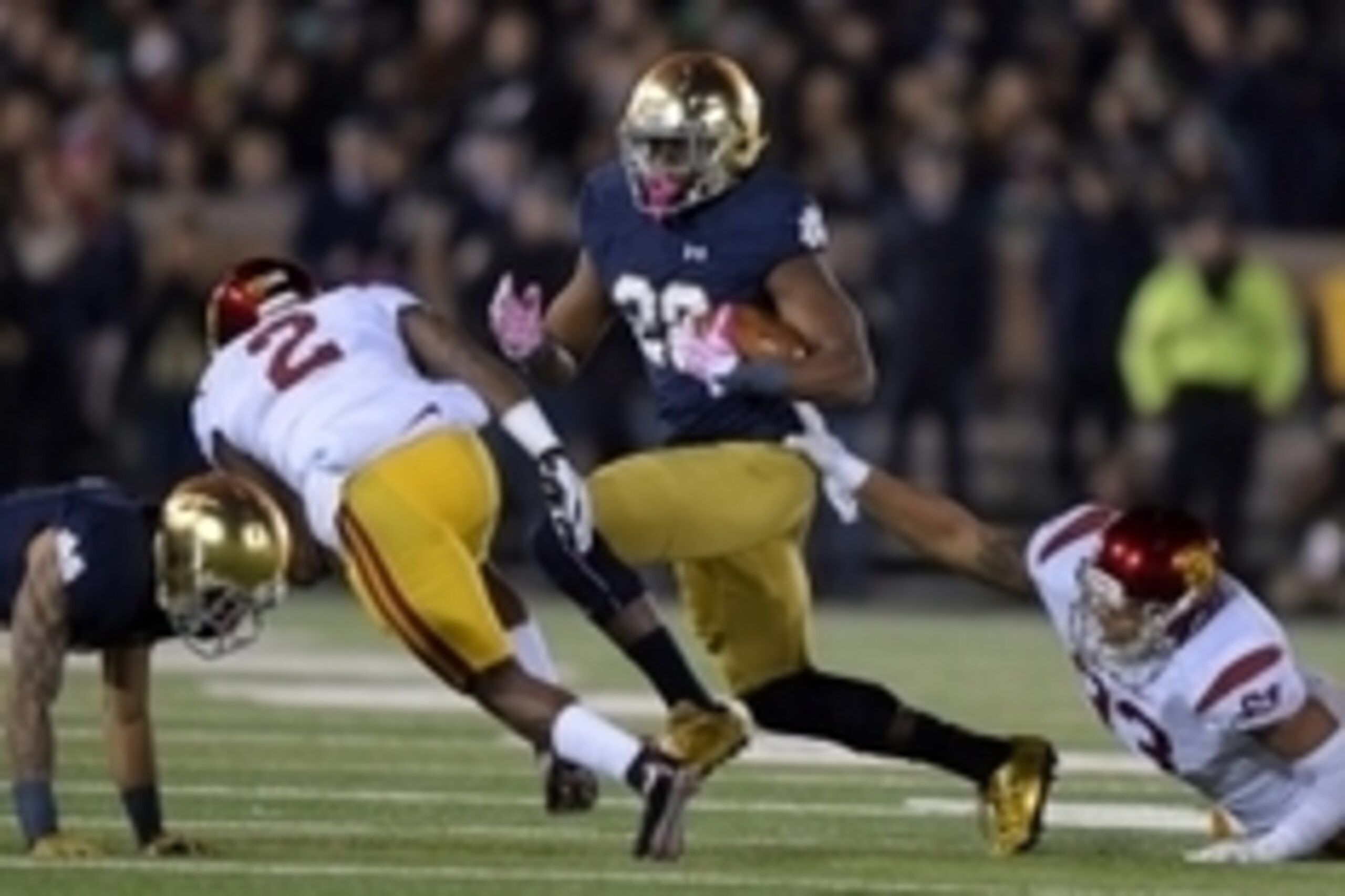 Oct 17, 2015; South Bend, IN, USA; Notre Dame Fighting Irish running back C.J. Prosise (20) is pursued by Southern California Trojans cornerback Adoree Jackson (2) and defensive end Greg Townsend Jr. (93) at Notre Dame Stadium. Mandatory Credit: Kirby Lee