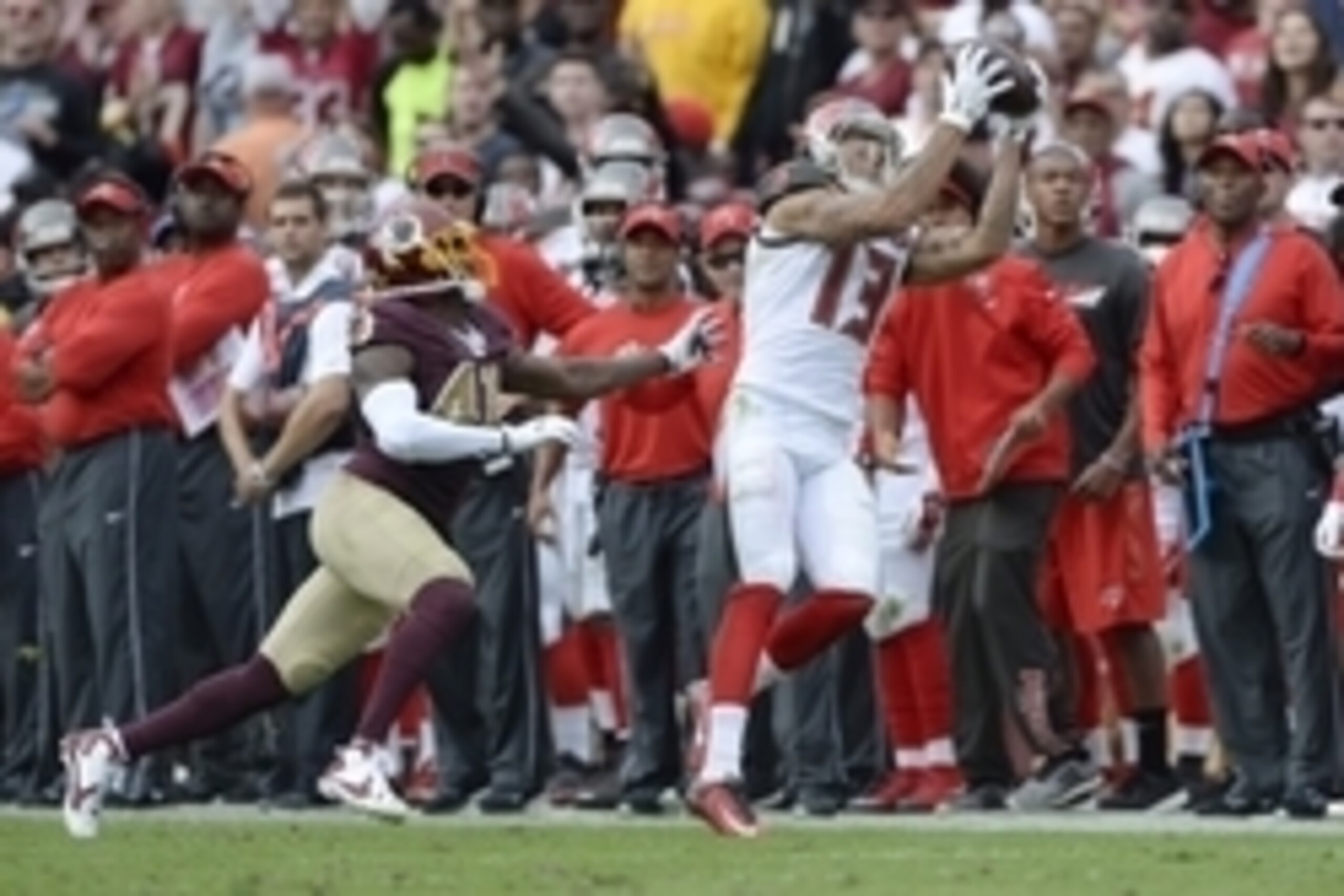 Oct 25, 2015; Landover, MD, USA; Tampa Bay Buccaneers wide receiver Mike Evans (13) catches a pass as Washington Redskins cornerback Will Blackmon (41) defends during the third quarter at FedEx Field. Washington Redskins defeated Tampa Bay Buccaneers 31-3