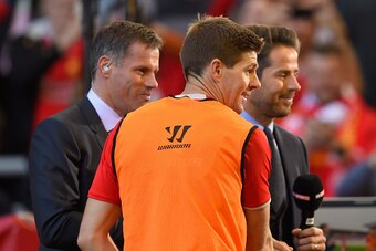 LIVERPOOL, ENGLAND - MAY 16:  Steven Gerrard of Liverpool talks to former Liverpool players Jamie Carragher and Jamie Reknappahead of the Barclays Premier League match between Liverpool and Crystal Palace at Anfield on May 16, 2015 in Liverpool, England. 