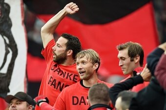 Leverkusen's Simon Rolfes (C), Leverkusen's midfielder Stefan Reinartz (R) and Leverkusen's midfielder Gonzalo Castro celebrate with fans after the German first division Bundesliga football match Bayer 04 Leverkusen vs TSG 1899 Hoffenheim in Leverkusen, w