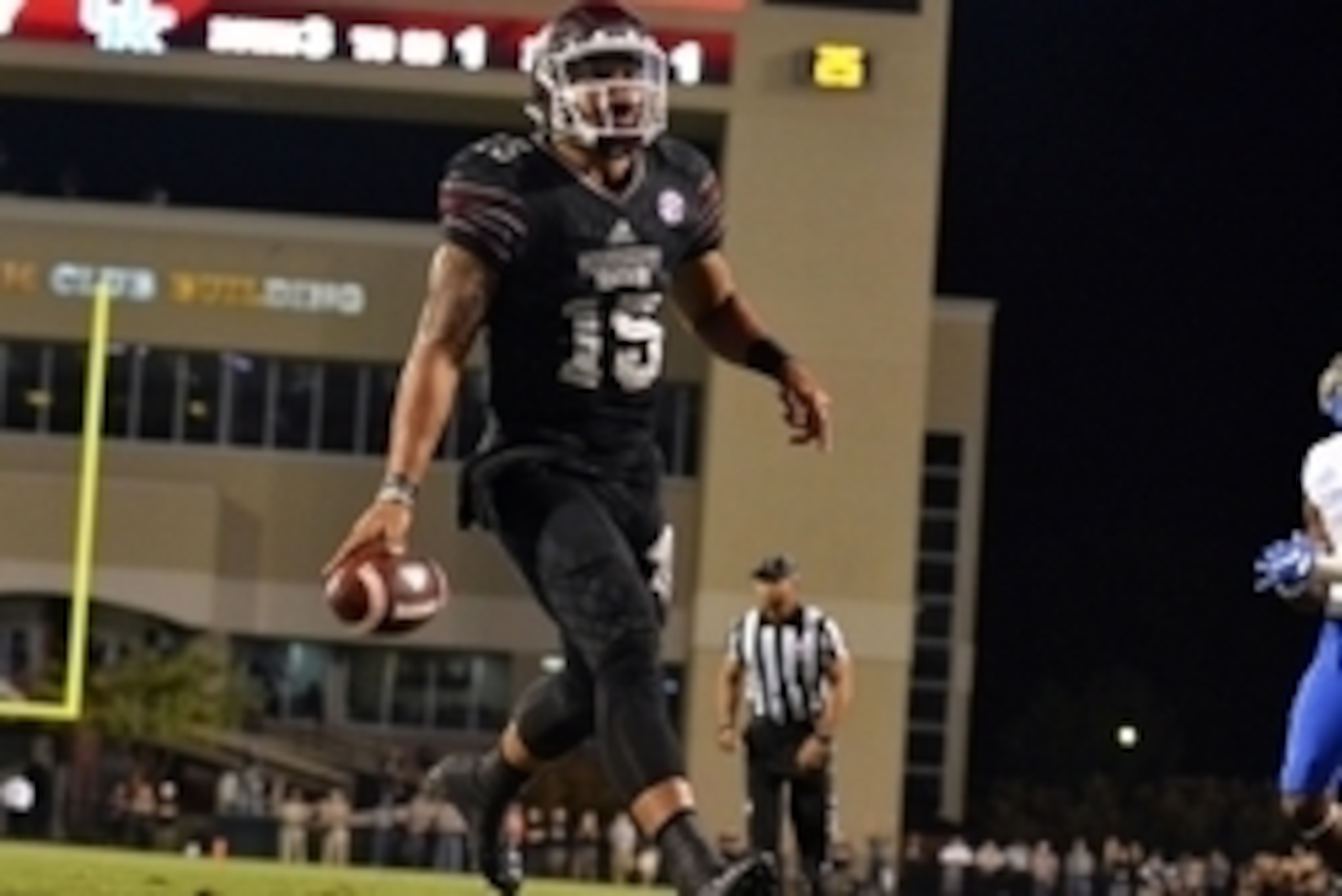 Oct 24, 2015; Starkville, MS, USA; Mississippi State Bulldogs quarterback Dak Prescott (15) celebrates after running for  a touchdown during the first quarter of the game against the Kentucky Wildcats at Davis Wade Stadium. Mandatory Credit: Matt Bush-USA