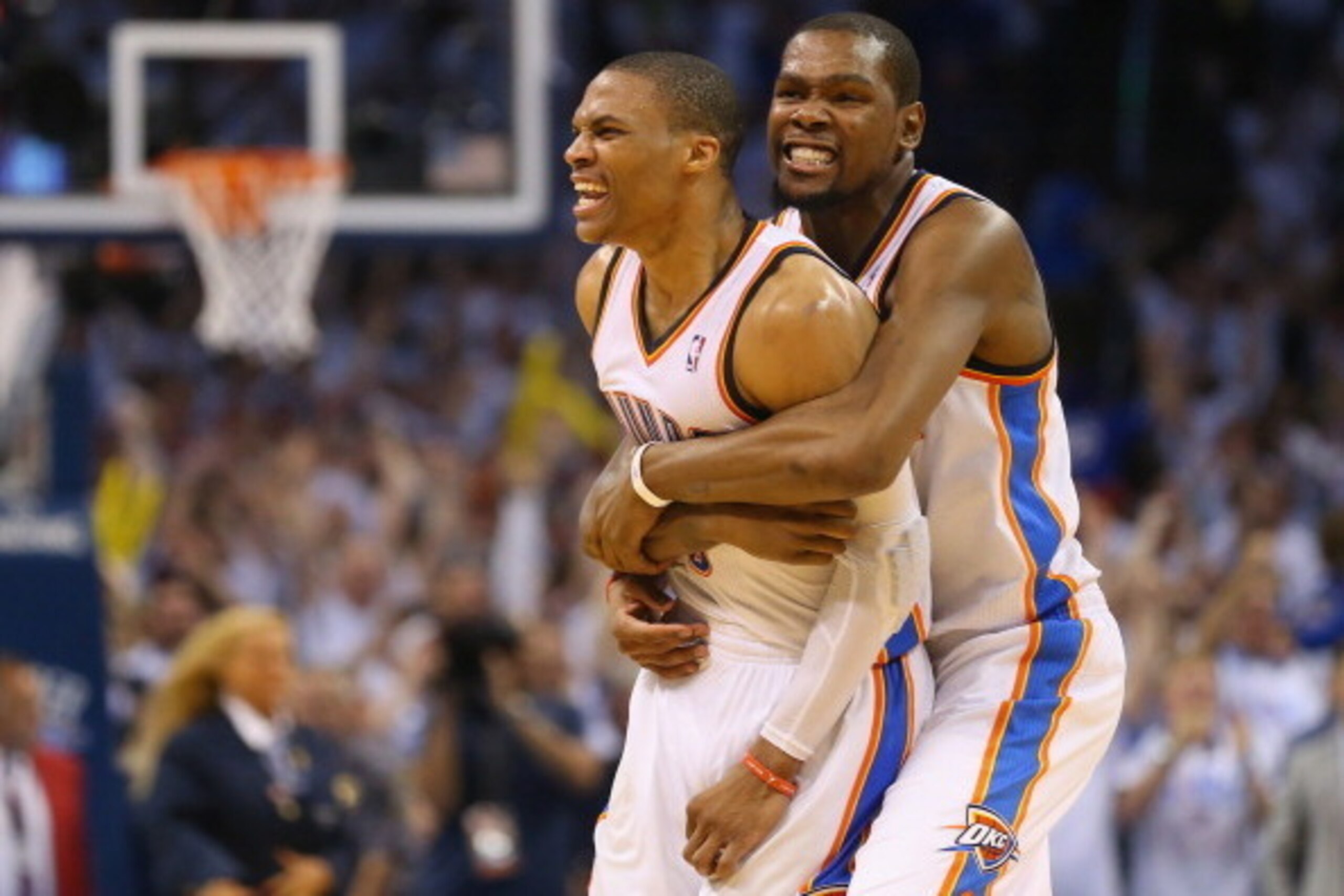 OKLAHOMA CITY, OK - MAY 13:  (L-R) Russell Westbrook #0 and Kevin Durant celebrate a 105-104 win against the Los Angeles Clippers in Game Five of the Western Conference Semifinals during the 2014 NBA Playoffs at Chesapeake Energy Arena on May 13, 2014 in 