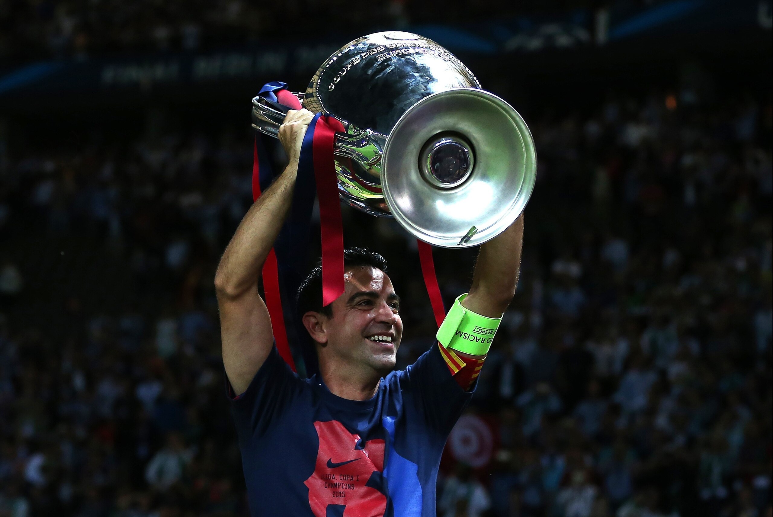 BERLIN, GERMANY - JUNE 6: Xavi of FC Barcelona lifts the trophy following the UEFA Champions League Final match between Juventus and FC Barcelona at the Olympiastadion on June 6, 2015 in Berlin, Germany. (Photo by Chris Brunskill Ltd/Getty Images)