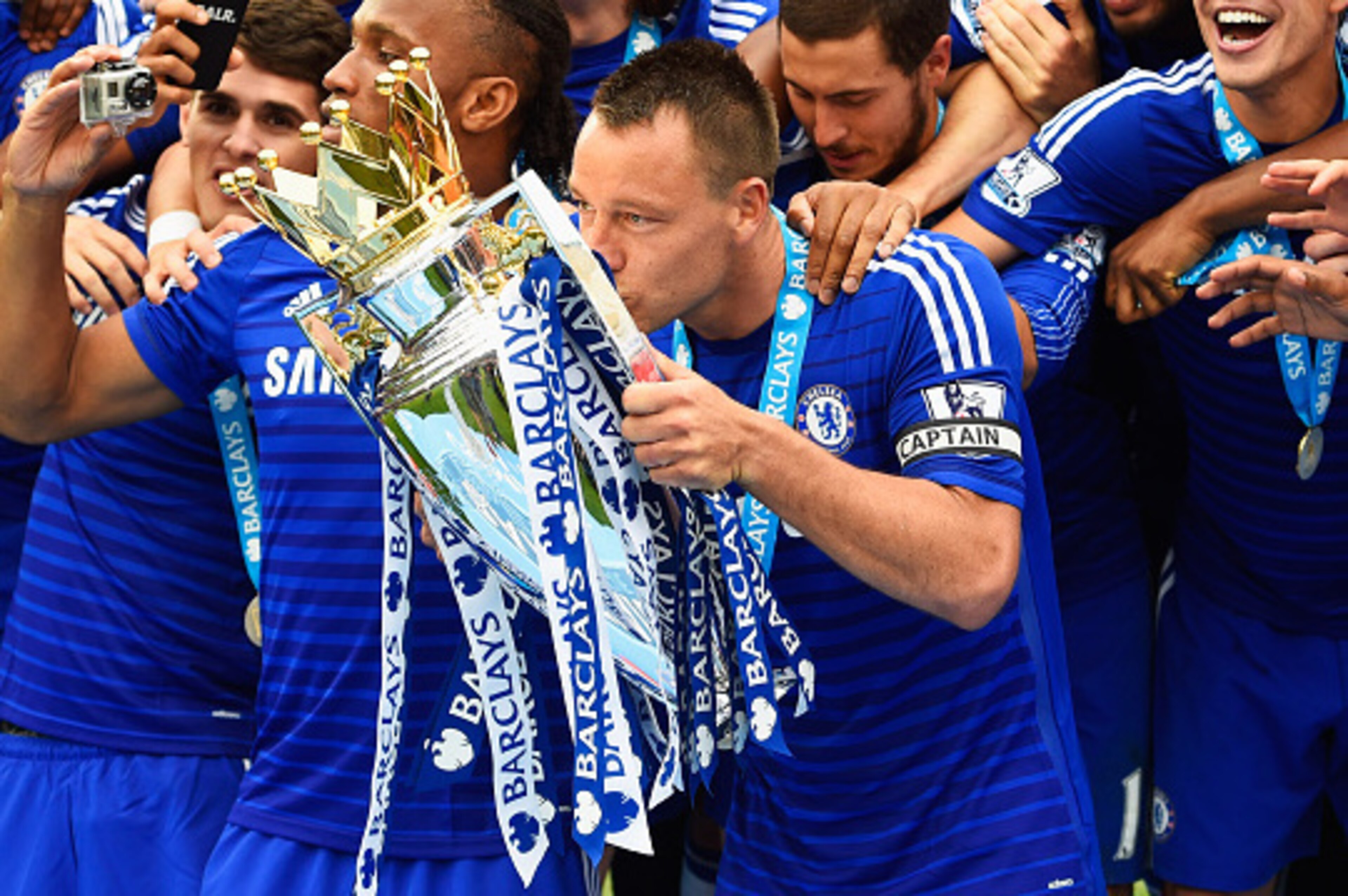 LONDON, ENGLAND - MAY 24:  John Terry of Chelsea celebrates with the trophy after the Barclays Premier League match between Chelsea and Sunderland at Stamford Bridge on May 24, 2015 in London, England. Chelsea were crowned Premier League champions.  (Phot