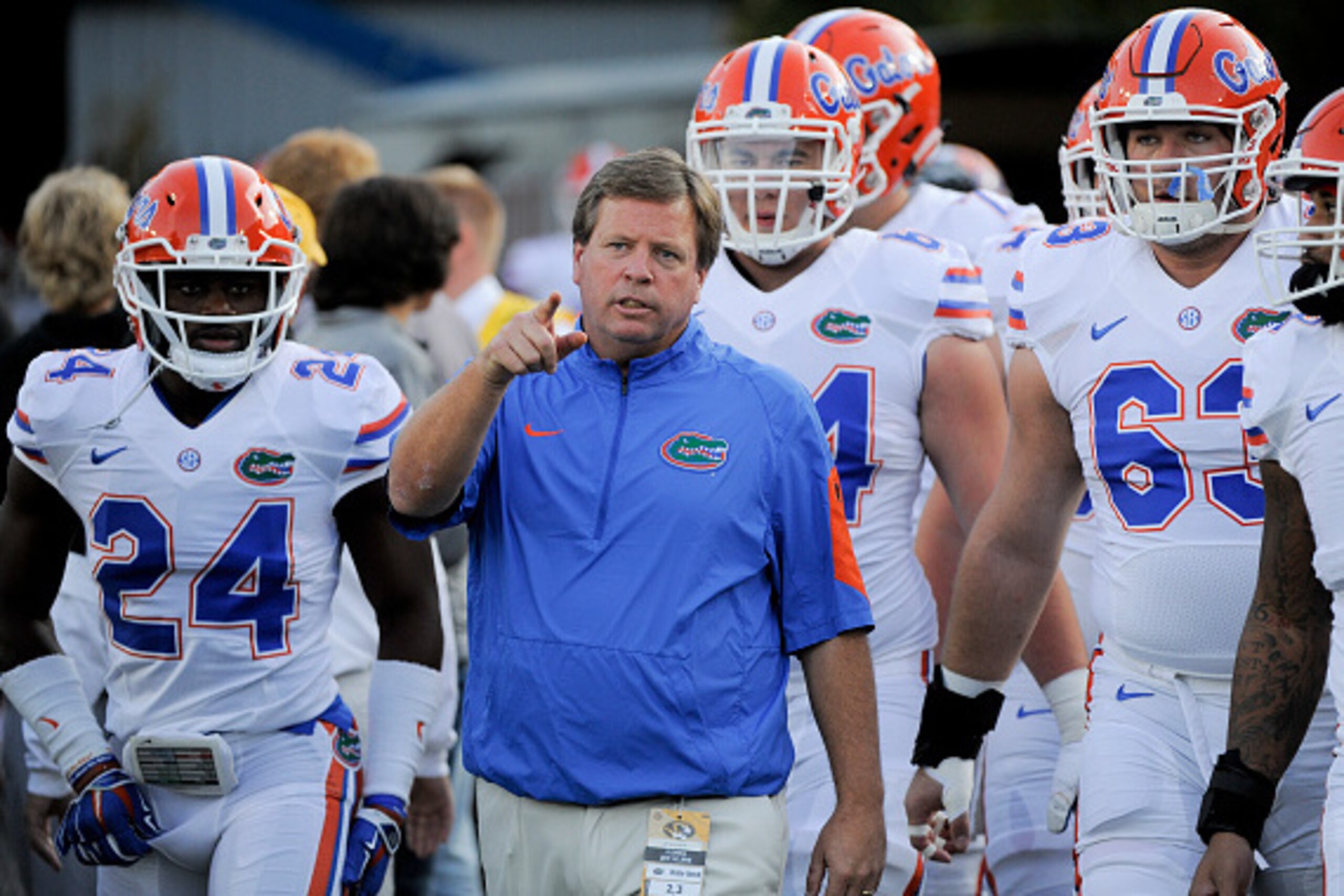 COLUMBIA, MO - OCTOBER 10:  Jim McElwain head coach of the Florida Gators leads members of team into Memorial Stadium for warm ups prior to a game against the Missouri Tigers on October 10, 2015 in Columbia, Missouri.  (Photo by Ed Zurga/Getty Images)