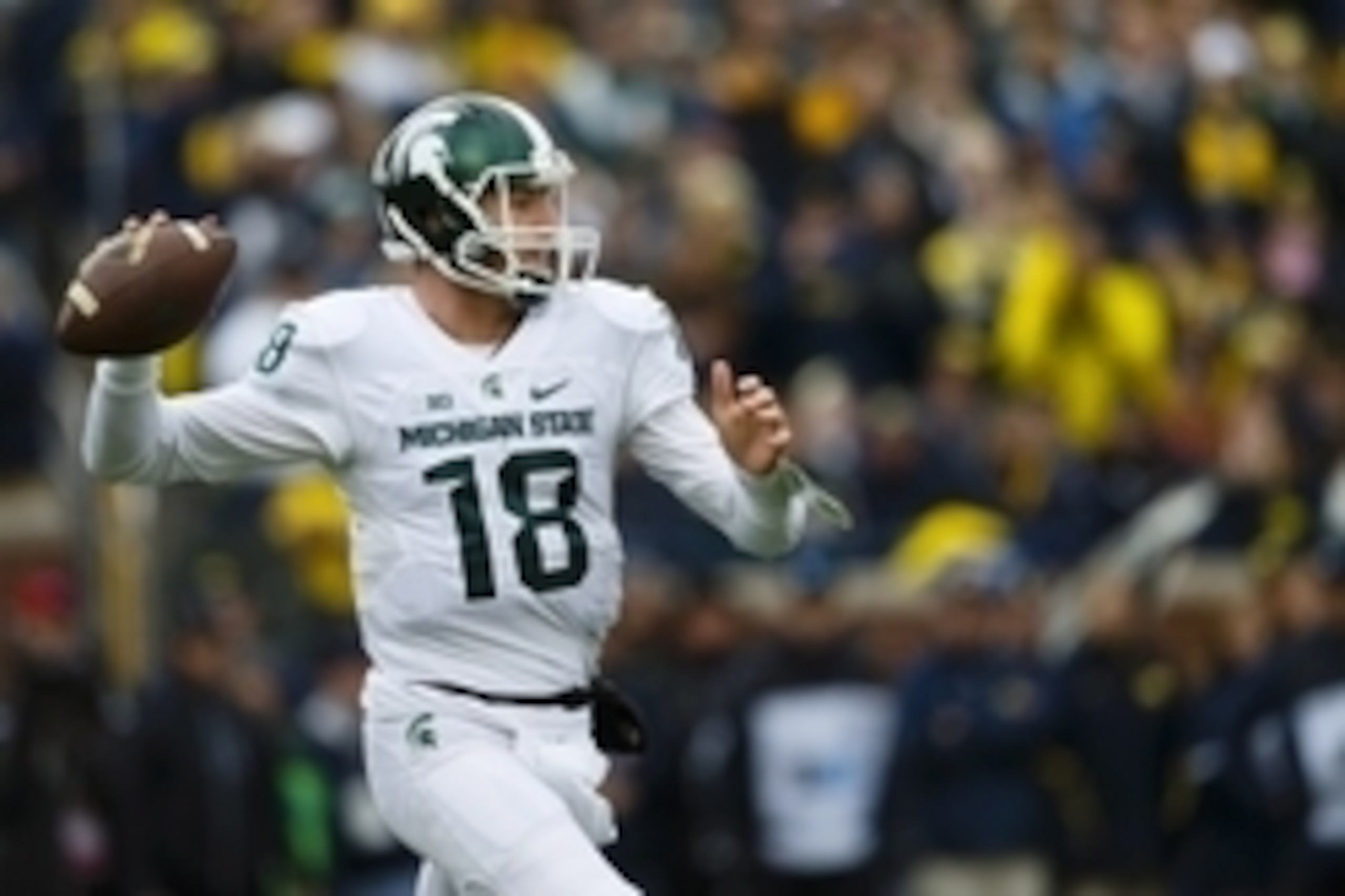 Oct 17, 2015; Ann Arbor, MI, USA; Michigan State Spartans quarterback Connor Cook (18) looks to make a pass in the first quarter against the Michigan Wolverines at Michigan Stadium. Mandatory Credit: Rick Osentoski-USA TODAY Sports