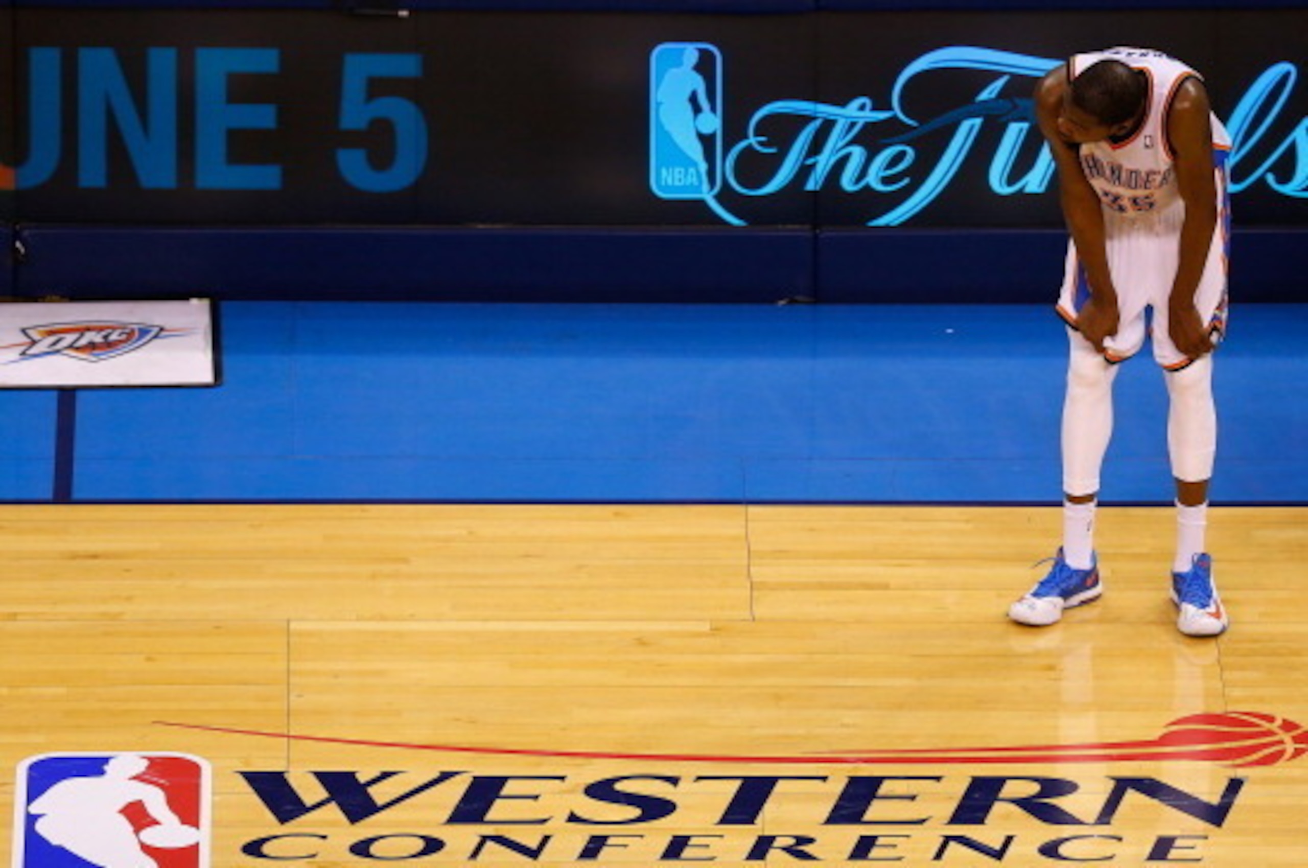 OKLAHOMA CITY, OK - MAY 31:  Kevin Durant #35 of the Oklahoma City Thunder waits on the court in the overtime period against the San Antonio Spurs during Game Six of the Western Conference Finals of the 2014 NBA Playoffs at Chesapeake Energy Arena on May 