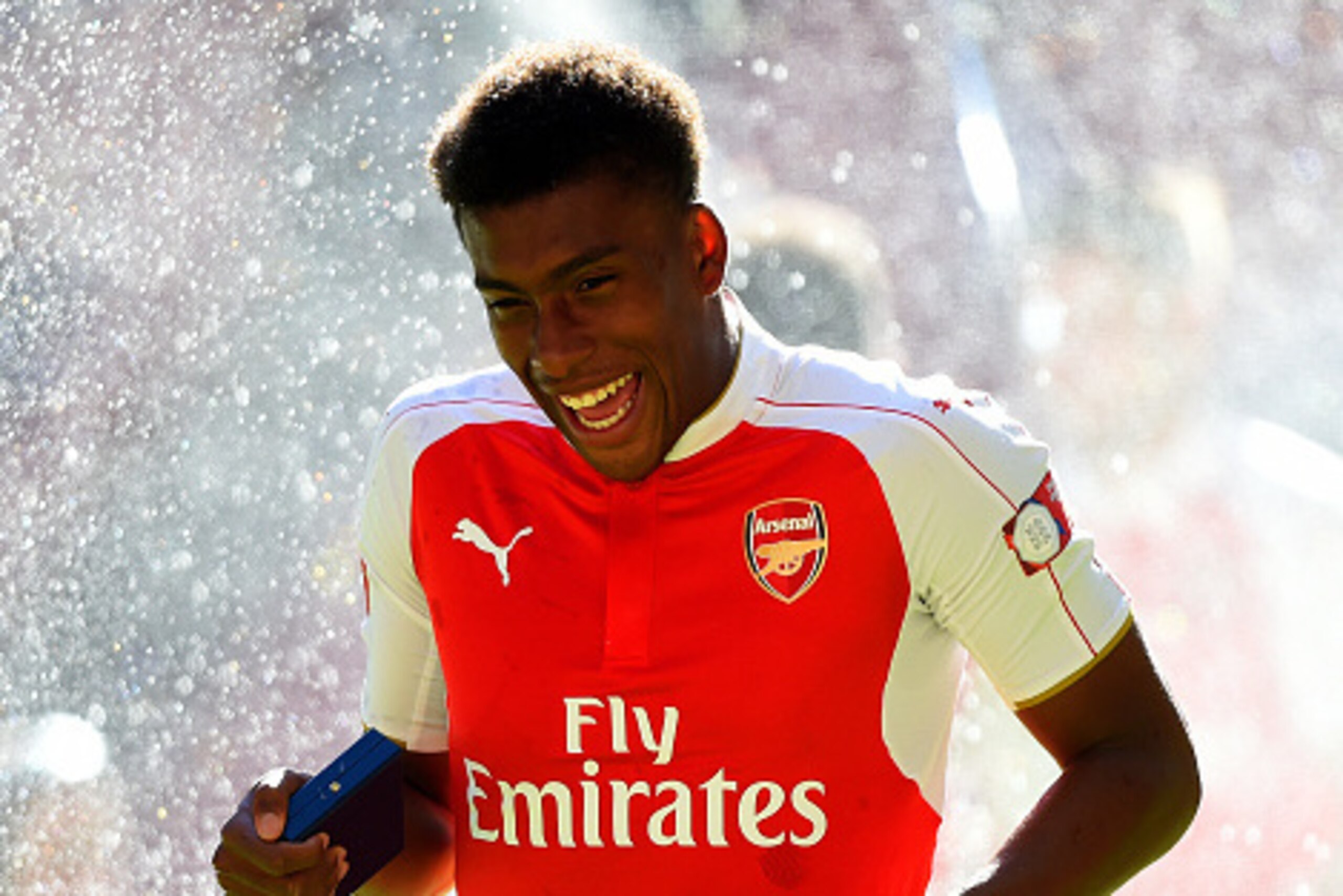 LONDON, ENGLAND - AUGUST 02:  Alex Iwobi of Arsenal celebrates his team's 1-0 win in the FA Community Shield match between Chelsea and Arsenal at Wembley Stadium on August 2, 2015 in London, England.  (Photo by Mike Hewitt/Getty Images)