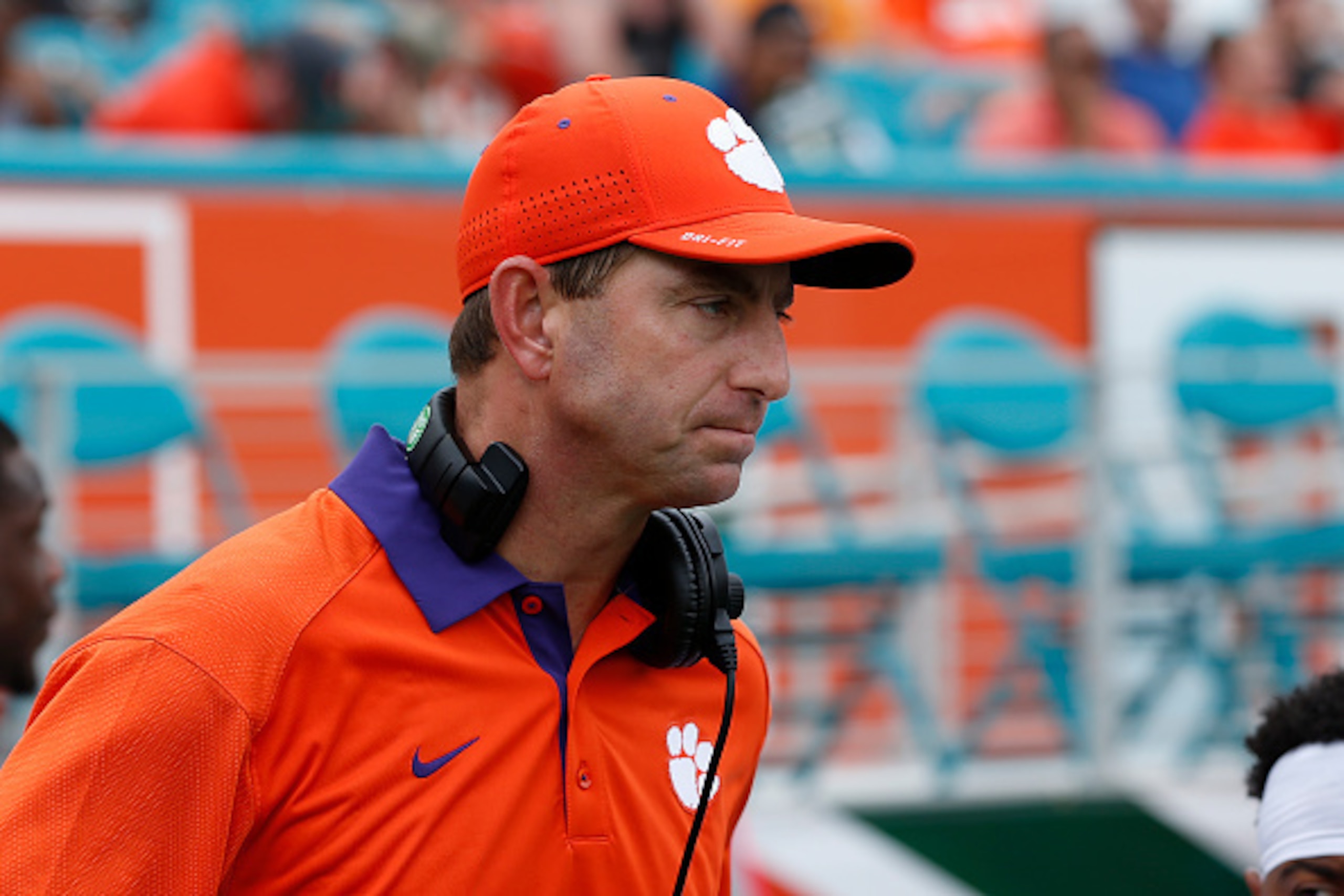 MIAMI GARDENS, FL - OCTOBER 24: Head coach Dabo Swinney of the Clemson Tigers walks back to the sideline during second quarter action against the Miami Hurricanes on October 24, 2015 at Sun Life Stadium in Miami Gardens, Florida. Clemson defeated Miami 58