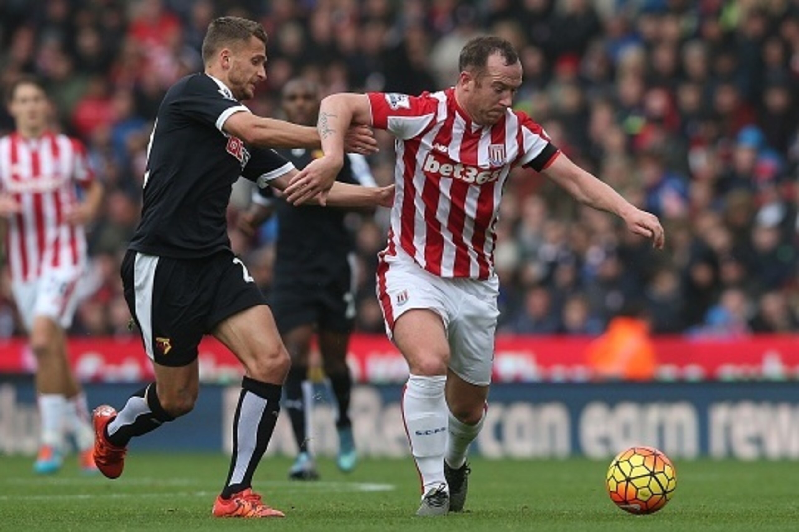 STOKE ON TRENT, ENGLAND - OCTOBER 24: Charlie Adam of Stoke City in action with Alman Abdi of Watford during the Barclays Premier League match between Stoke City and Watford on October 24, 2015 in Stoke on Trent, England. (Photo by Chris Brunskill/Getty I
