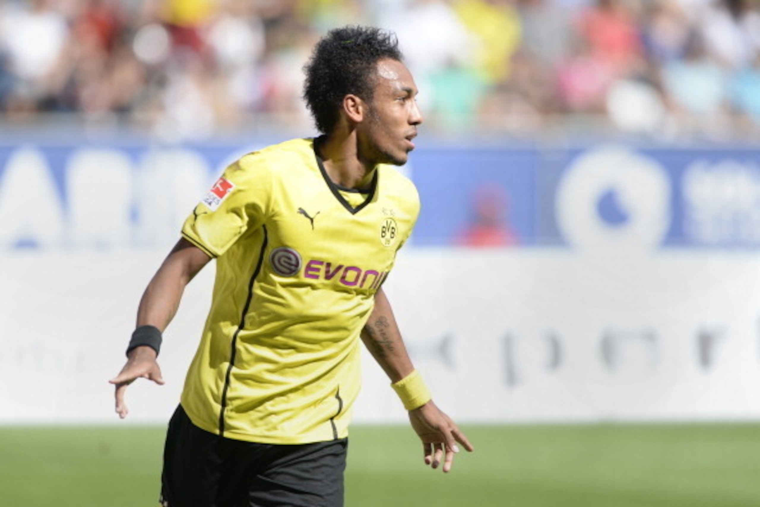 Dortmund's Gabunian Pierre-Emerick Aubameyang celebrates after the first goal for Dortmund during the German first division Bundesliga football match FC Augsburg vs Borussia Dortmund in Augsburg, southern Germany on August 10, 2013.  AFP PHOTO / CHRISTOF