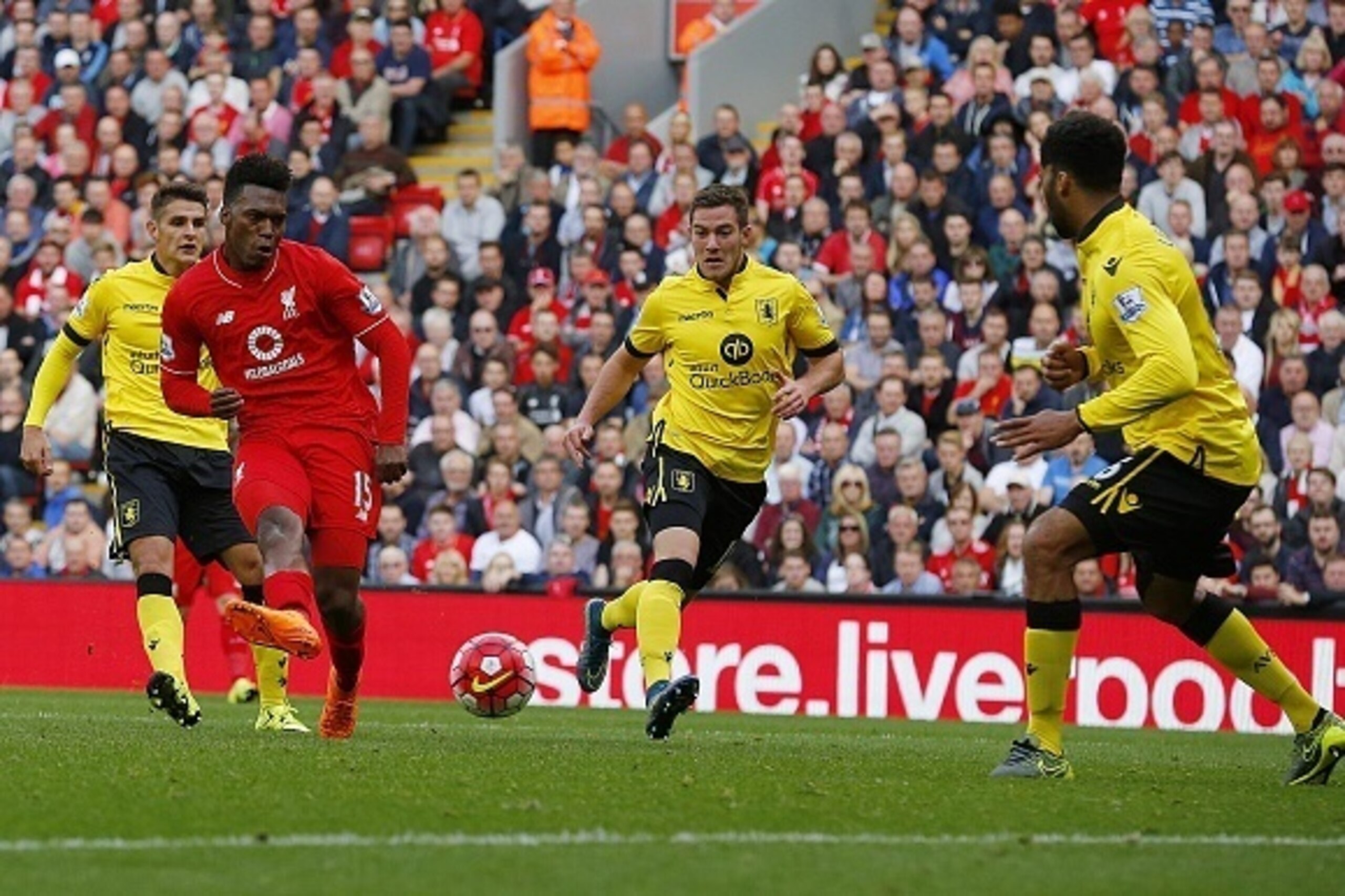 Liverpool's English striker Daniel Sturridge (2nd L) scores his team's third goal during the English Premier League football match between Liverpool and Aston Villa at the Anfield stadium in Liverpool, north-west England on September 26, 2015. AFP PHOTO /