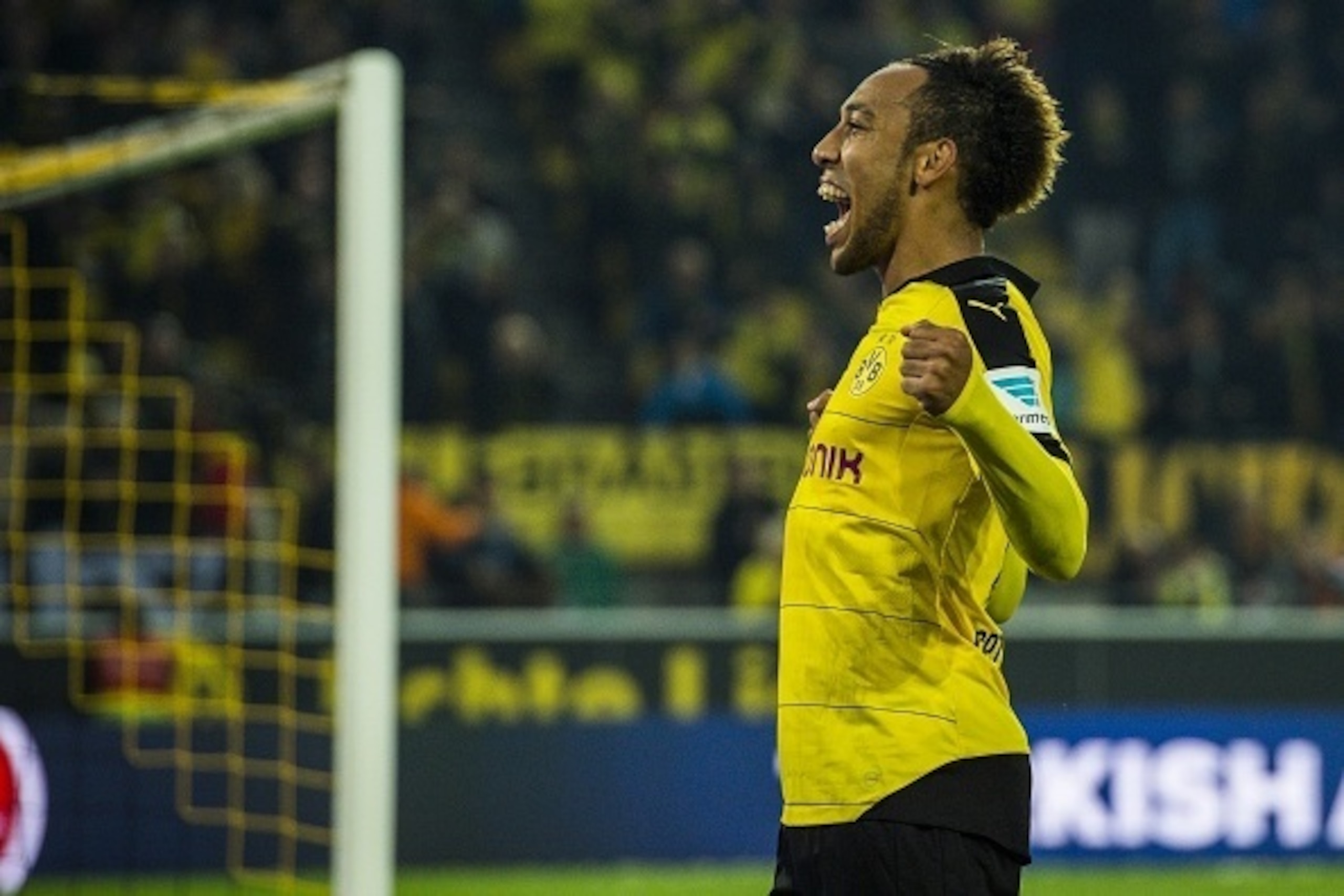 Dortmund's Gabonese midfielder Pierre-Emerick Aubameyang celebrates scoring his side's 5th goal to complete his hat-trick during the German first division football Bundesliga match between Borussia Dortmund and FC Augsburg on October 25, 2015 in Dortmund,