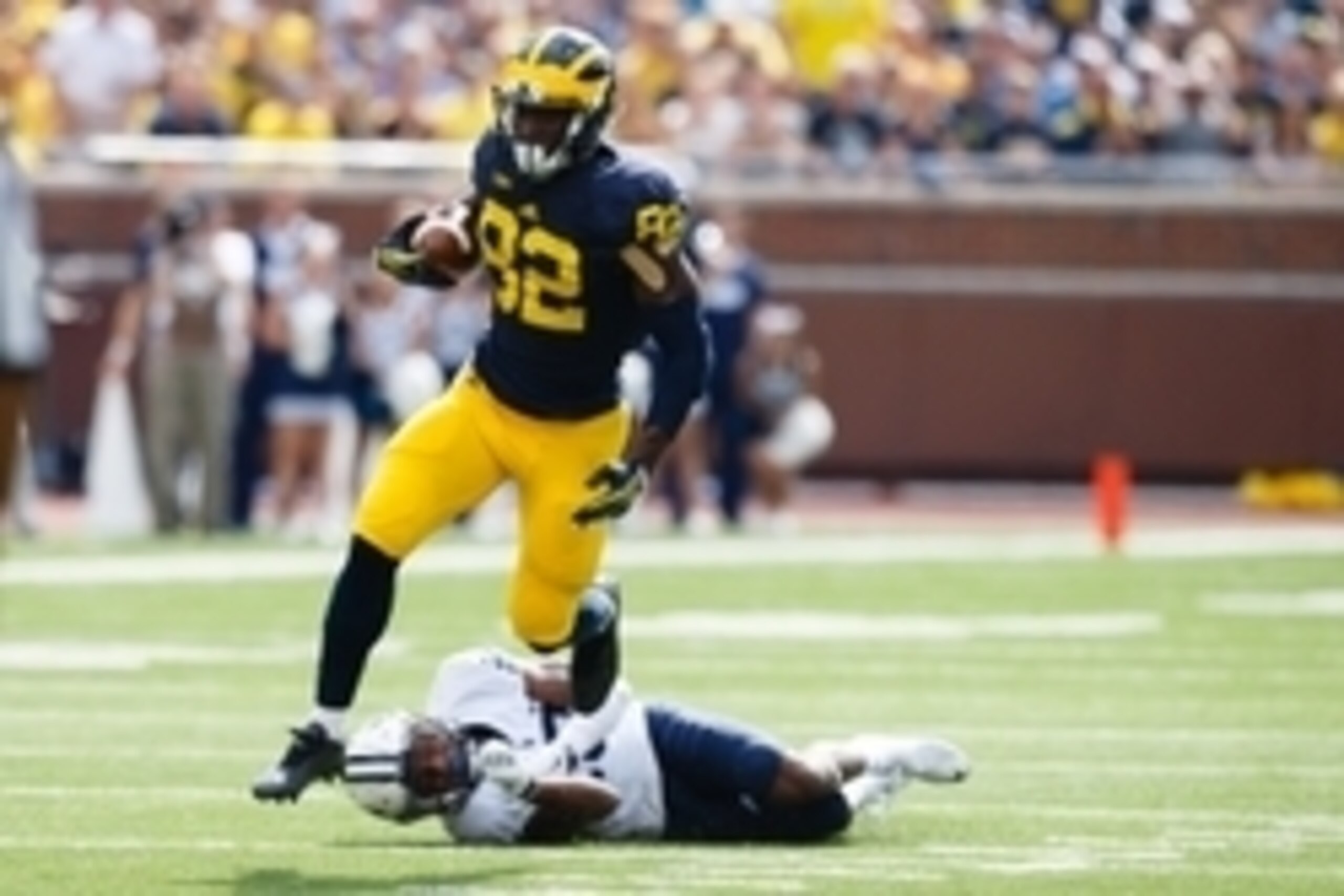 Sep 26, 2015; Ann Arbor, MI, USA; Michigan Wolverines wide receiver Amara Darboh (82) rushes on Brigham Young Cougars defensive back Michael Shelton (18) in the second quarter at Michigan Stadium. Mandatory Credit: Rick Osentoski-USA TODAY Sports