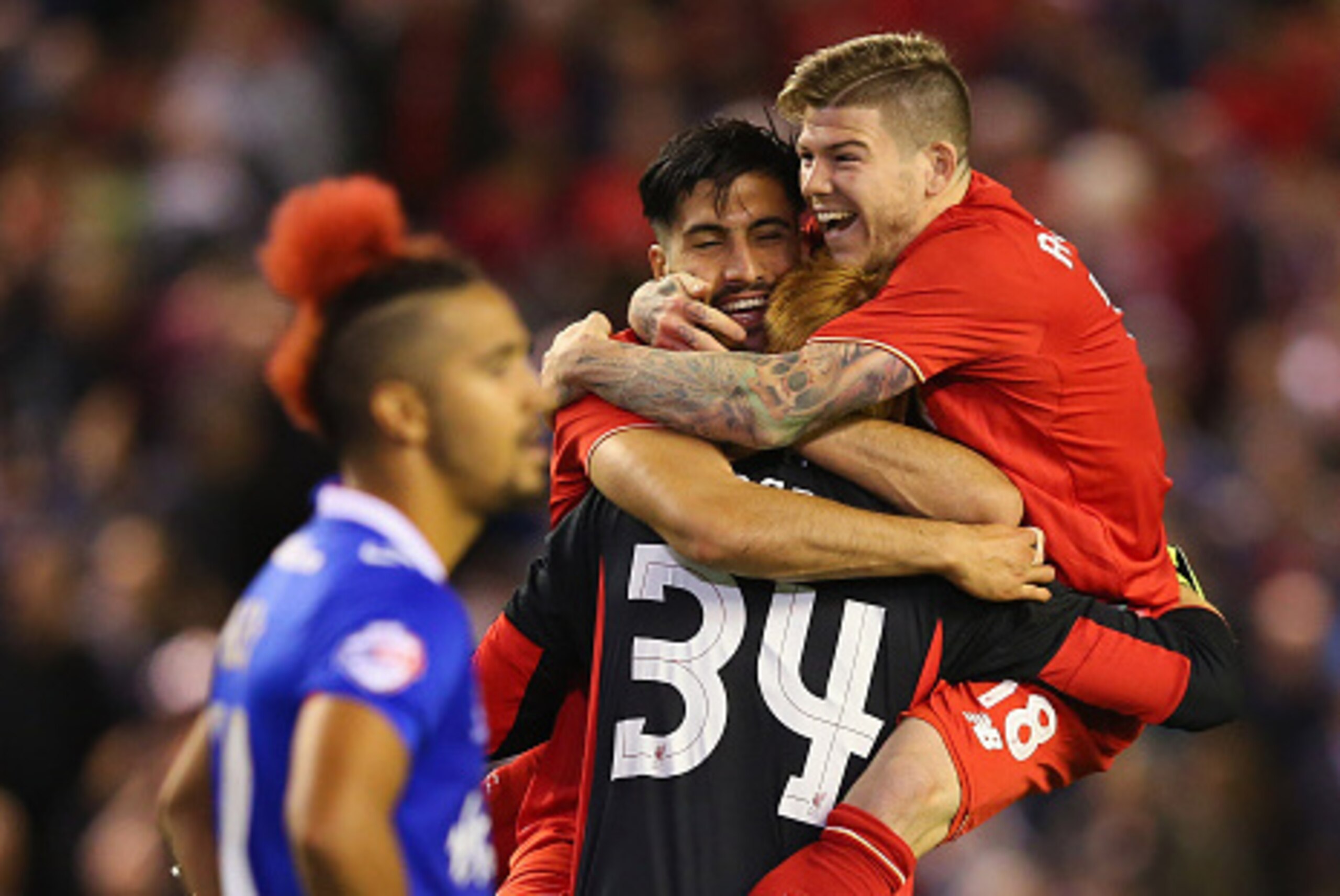 LIVERPOOL, ENGLAND - SEPTEMBER 23:  Adam Bogdan of Liverpool celebrates with Alberto Moreno and Emre Can after saving the crucial penalty from Bastien Hery of Carlisle United who looks on in the foreground during the Capital One Cup Third Round match betw