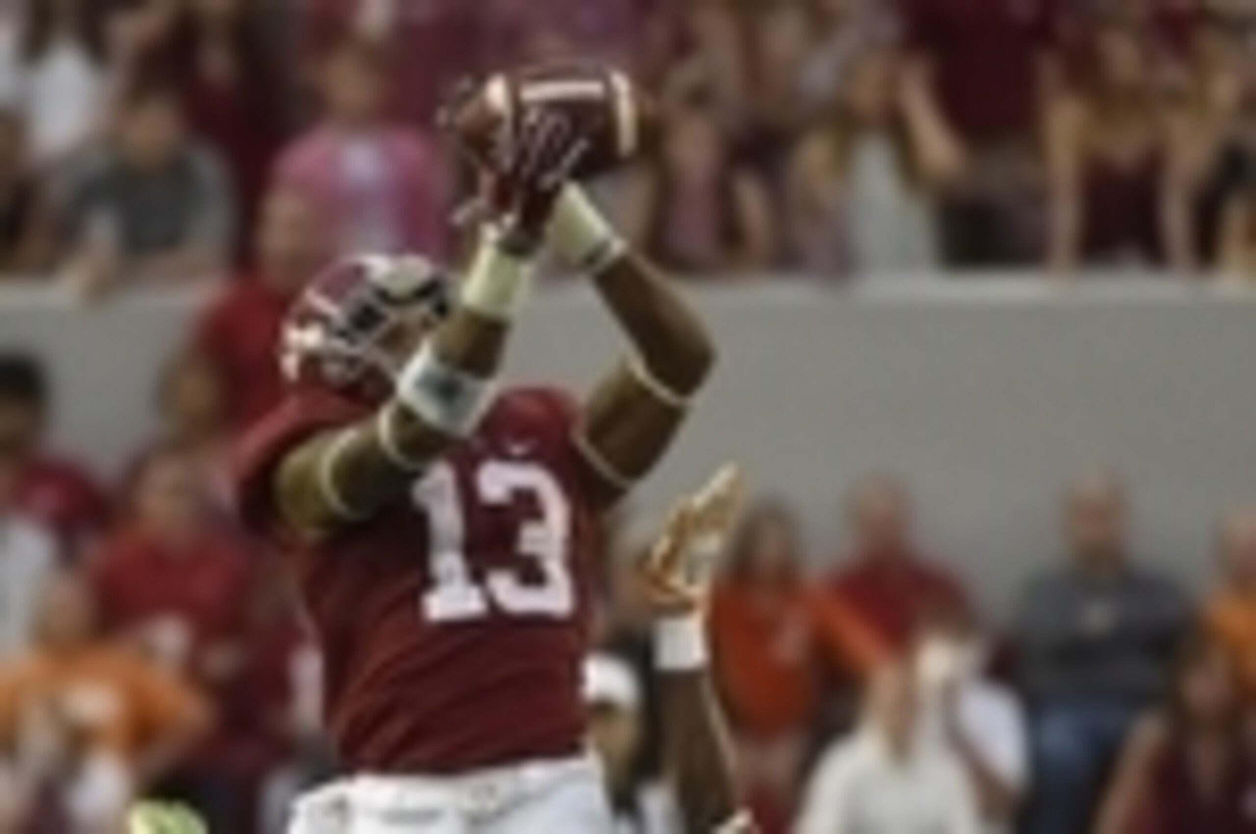 Oct 24, 2015; Tuscaloosa, AL, USA; Alabama Crimson Tide wide receiver ArDarius Stewart (13) pulls down a pass over Tennessee Volunteers defensive back Justin Martin (8) during the fourth quarter at Bryant-Denny Stadium. Mandatory Credit: John David Mercer