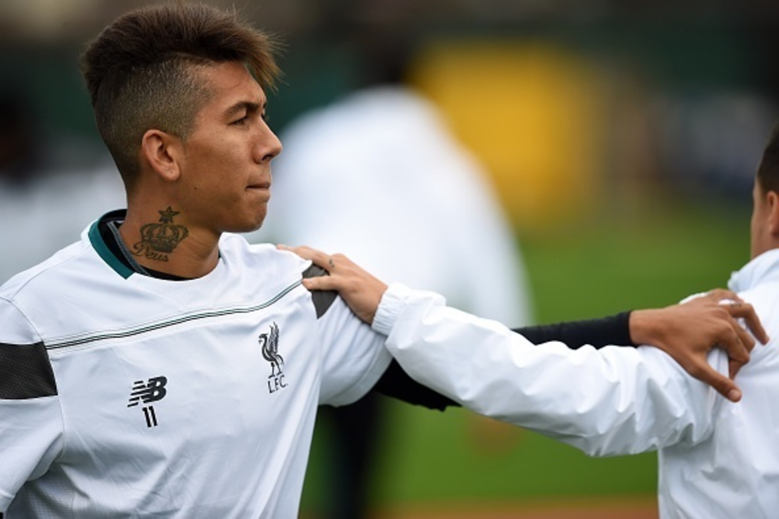 Liverpool's Brazilian midfielder Roberto Firmino stretches during a team training session in Liverpool, northwest England, on October 21, 2015, on the eve of their UEFA Europa League group B football match against Rubin Kazan. AFP PHOTO / PAUL ELLIS Liverpool's Brazilian midfielder Roberto Firmino stretches during a team training session in Liverpool, northwest England, on October 21, 2015, on the eve of their UEFA Europa League group B football match against Rubin Kazan. AFP PHOTO / PAUL ELLIS