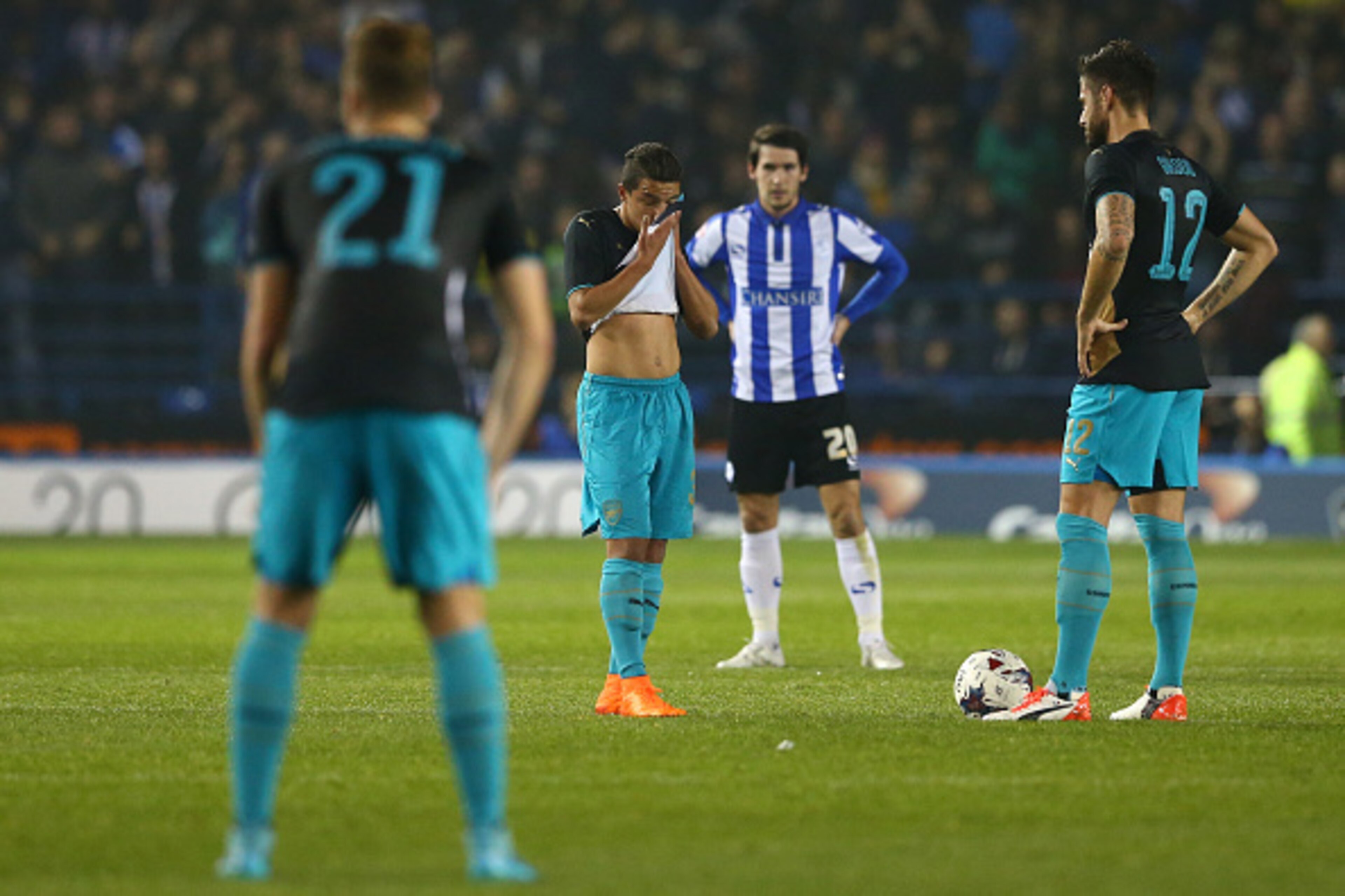 SHEFFIELD, ENGLAND - OCTOBER 27:  Dejected Arsenal players look on after conceding the opening goal during the Capital One Cup fourth round match between Sheffield Wednesday and Arsenal at Hillsborough Stadium on October 27, 2015 in Sheffield, England.  (