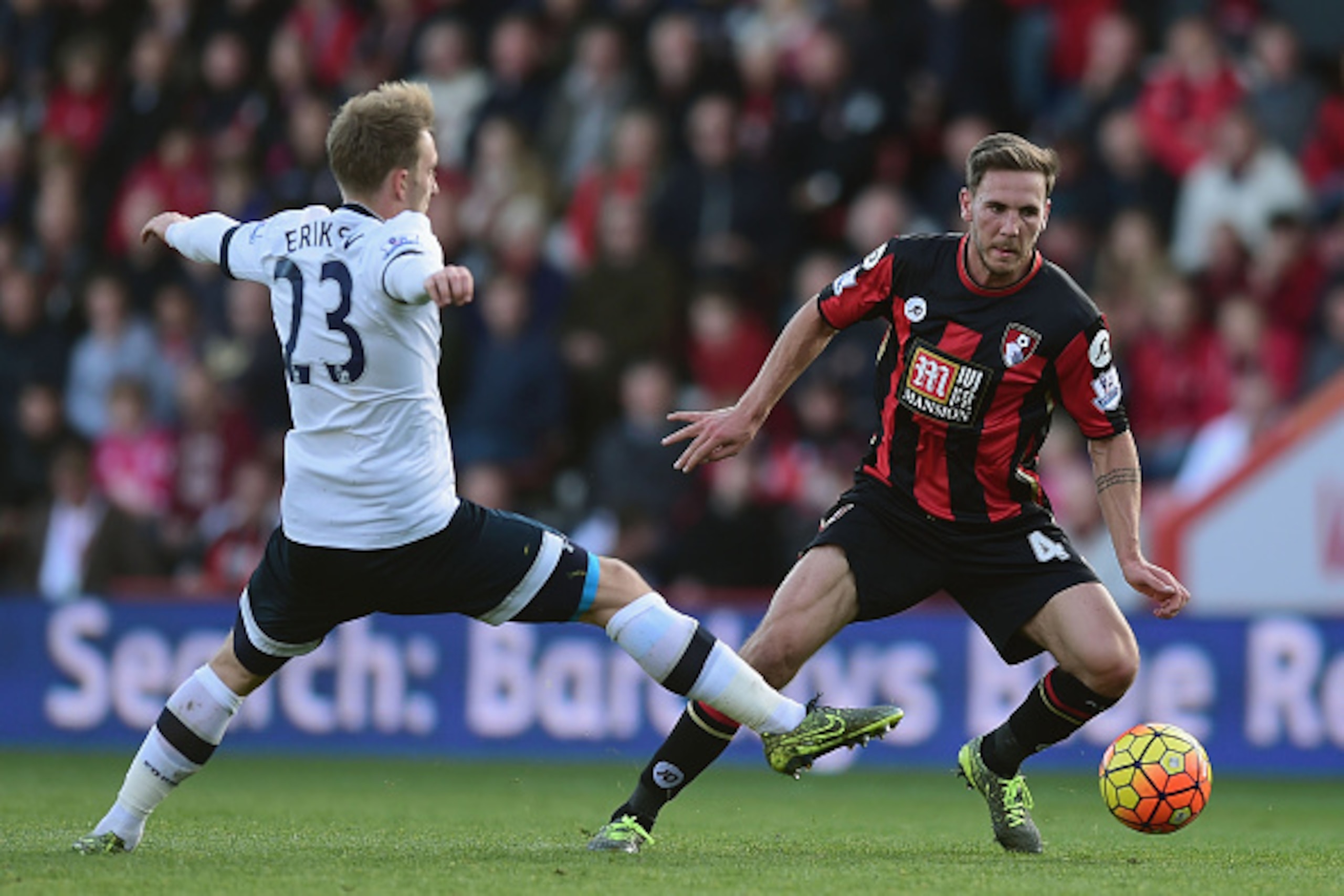 BOURNEMOUTH, ENGLAND - OCTOBER 25: Dan Gosling of Bournemouth and Christian Eriksen of Tottenham Hotspur compete for the ball during the Barclays Premier League match between A.F.C. Bournemouth and Tottenham Hotspur at Vitality Stadium on October 25, 2015