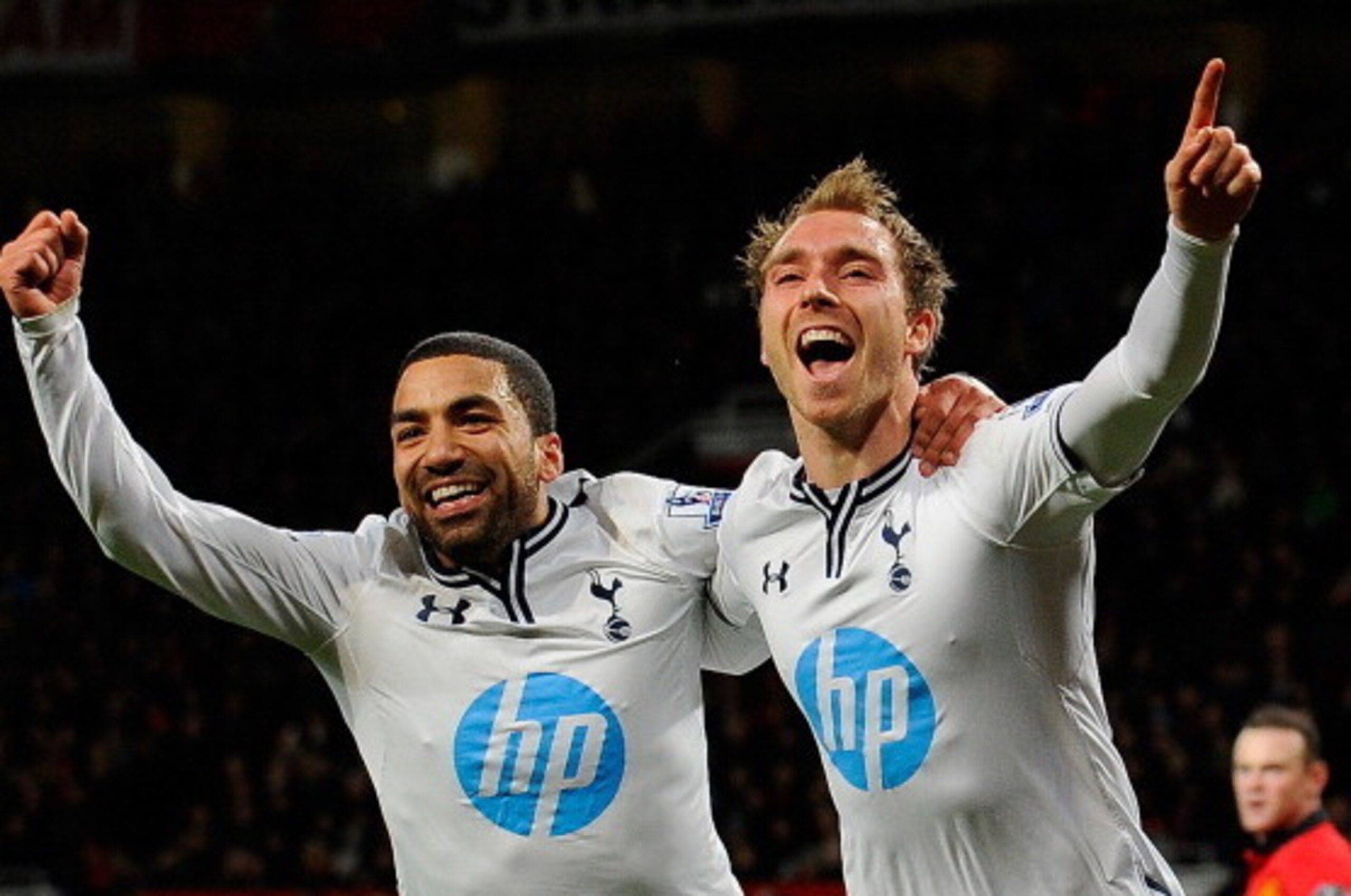 Tottenham Hotspur's Danish midfielder Christian Eriksen (R) celebrates with Tottenham Hotspur's English midfielder Aaron Lennon (L) after scoring the second goal during the English Premier League football match between Manchester United and Tottenham Hots
